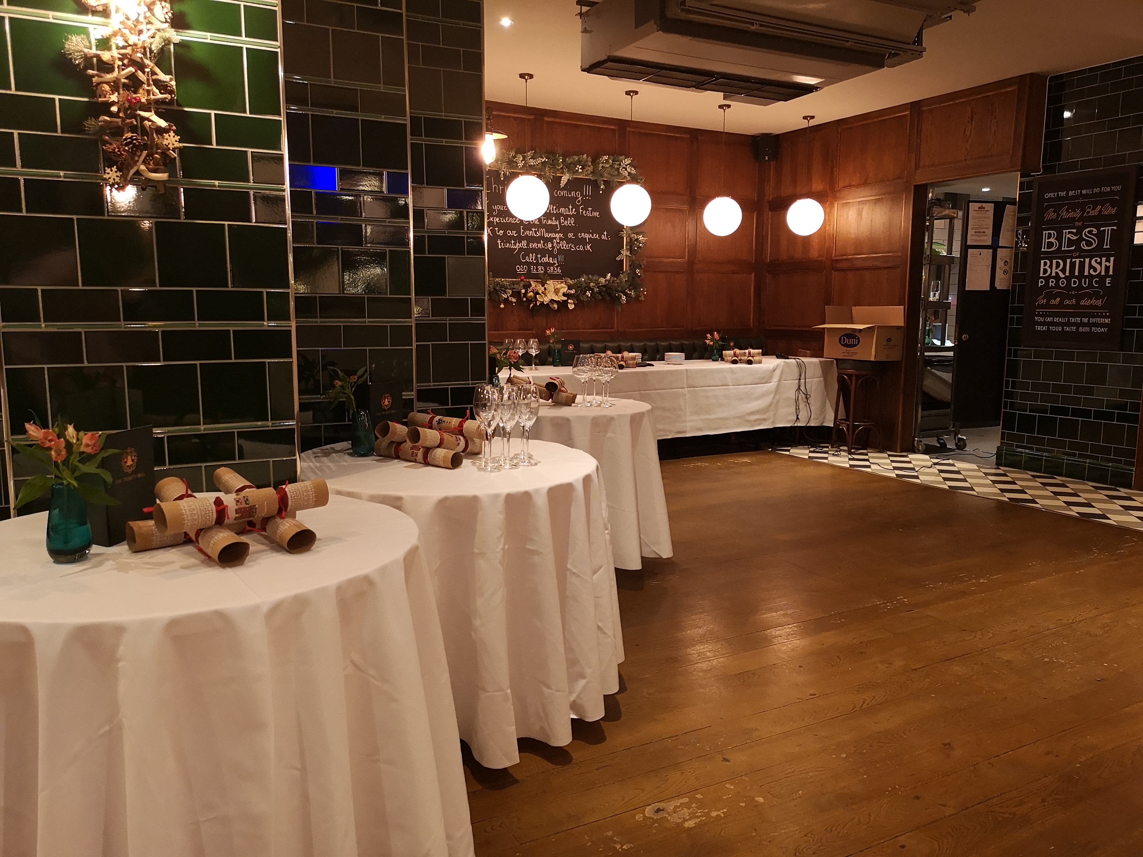 Elegant event space at The Trinity Bell with draped tables for networking and celebrations.