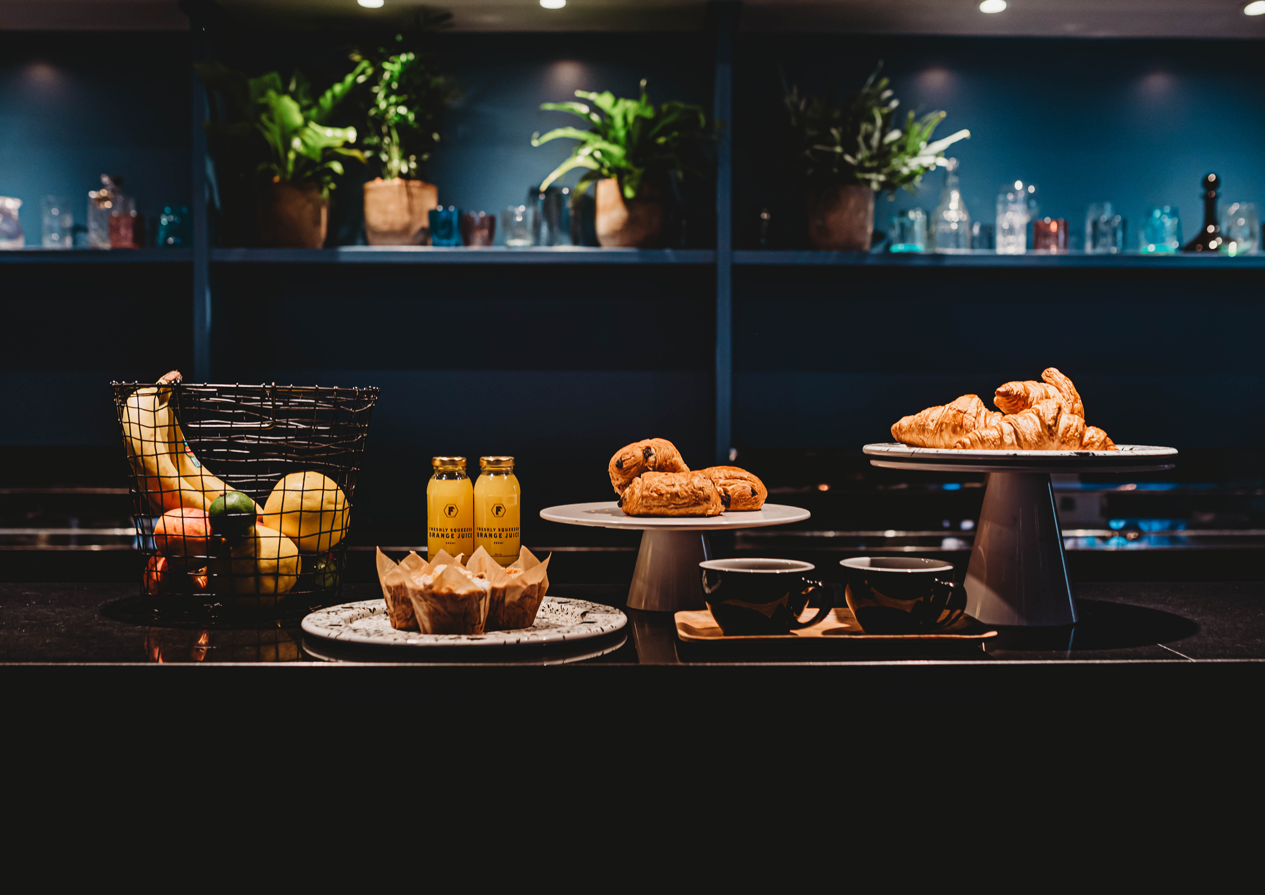 Refreshment station at The Storehouse, featuring pastries and fruits for events.