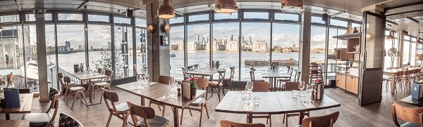 Stylish waterfront venue with skyline views, perfect for events and gatherings.