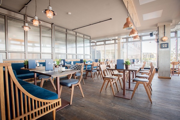 Modern meeting venue with natural light and stylish decor for events.