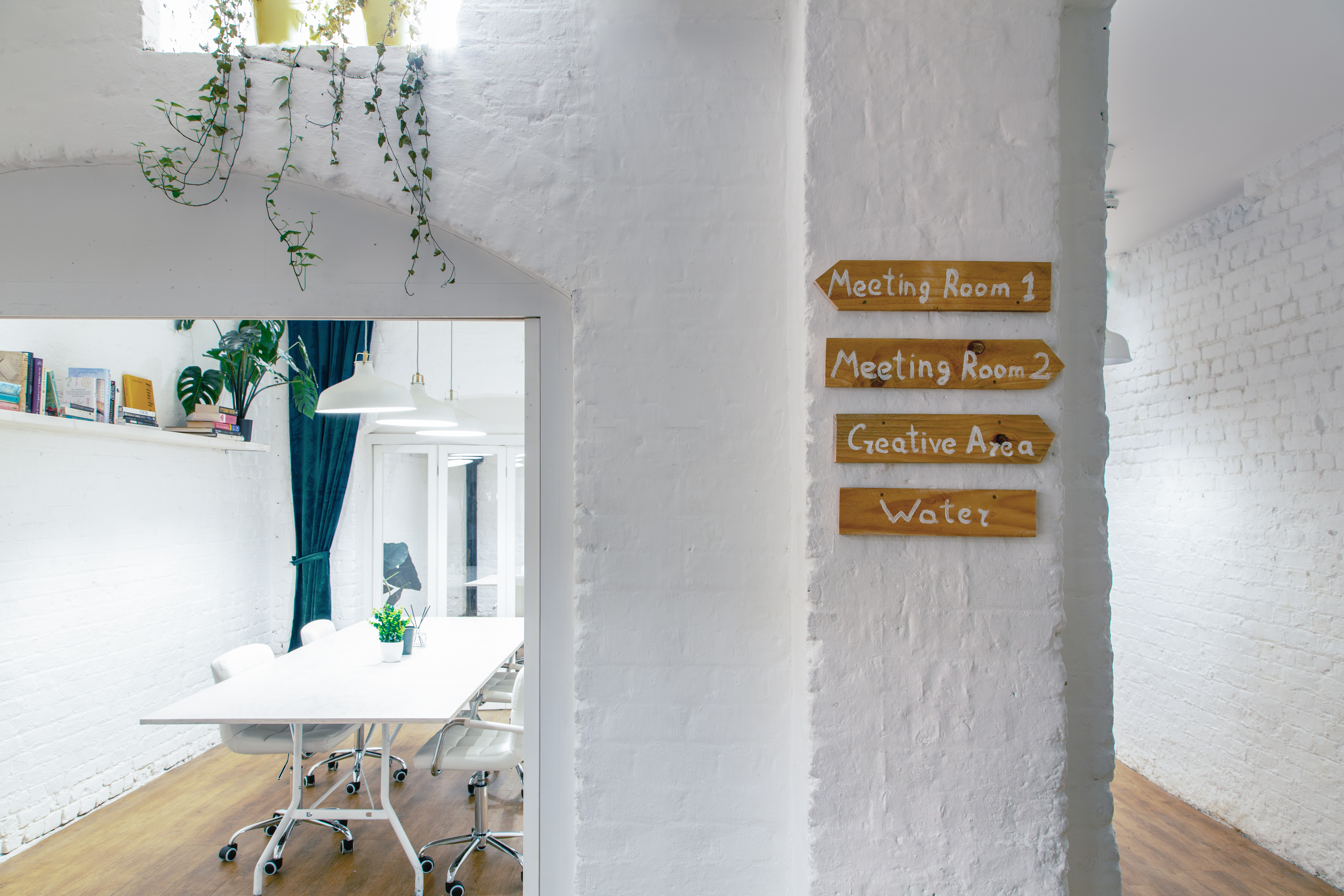 Bright meeting space at Cobalance Cafe with clear signage for productive events.