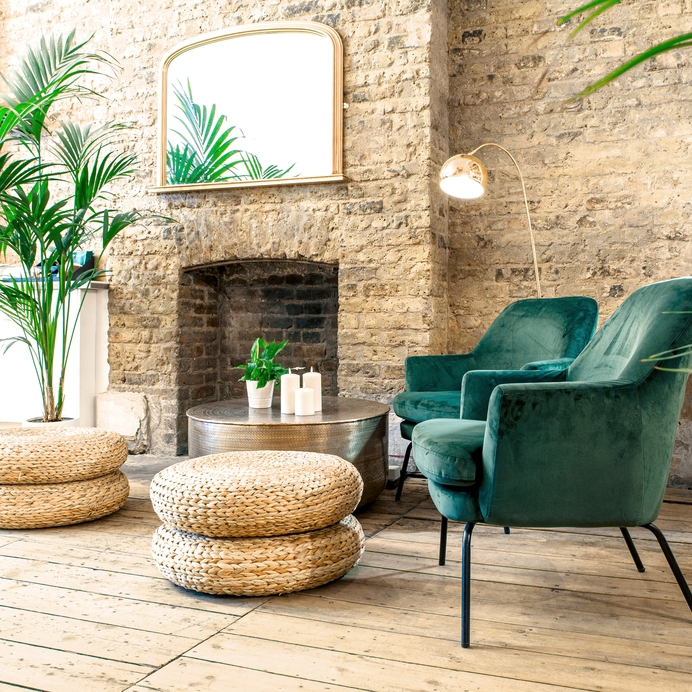 Stylish lounge area with plush green chairs for networking events at Cobalance Cafe.