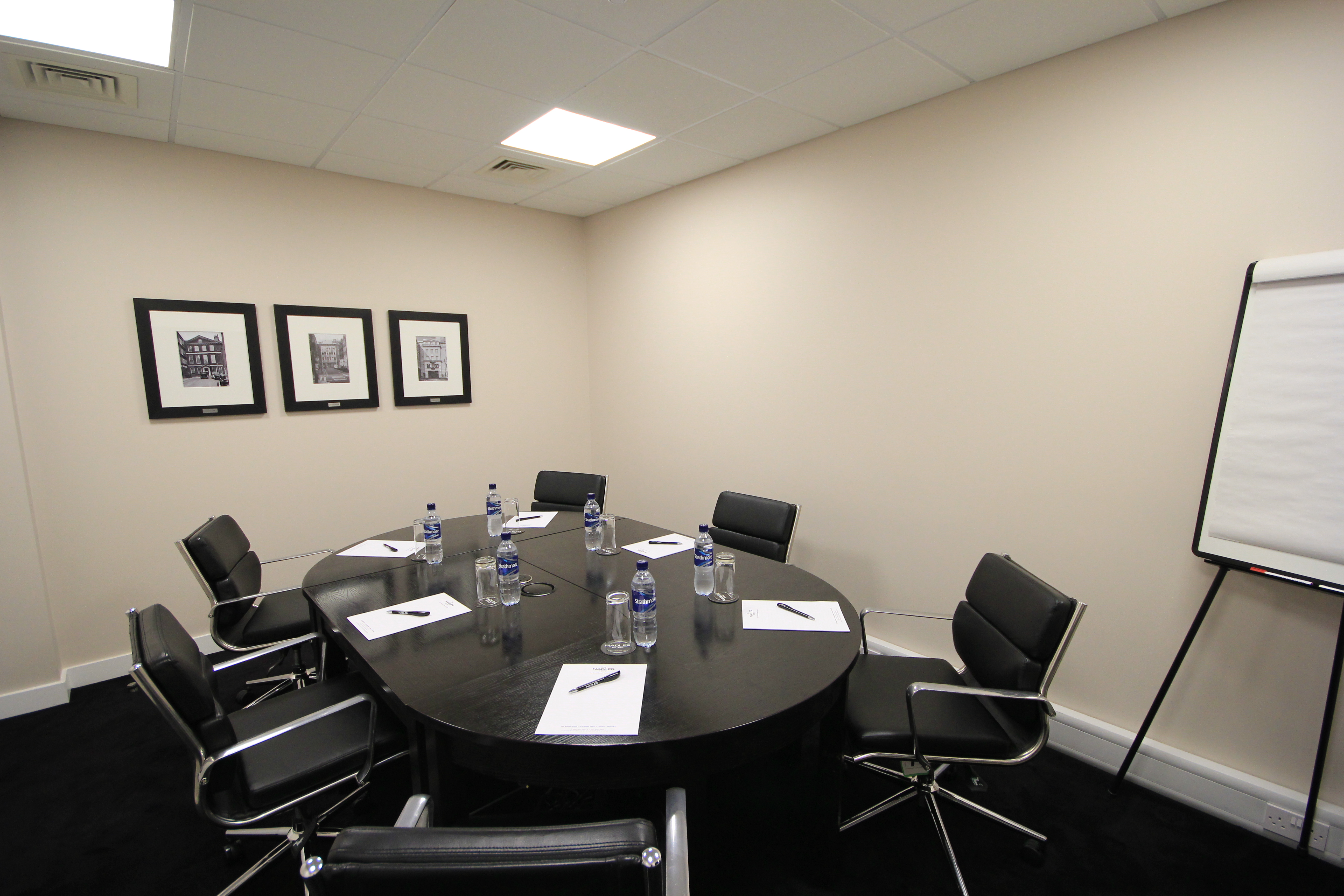 Nadler Soho Boardroom with round table, perfect for strategic meetings and workshops.