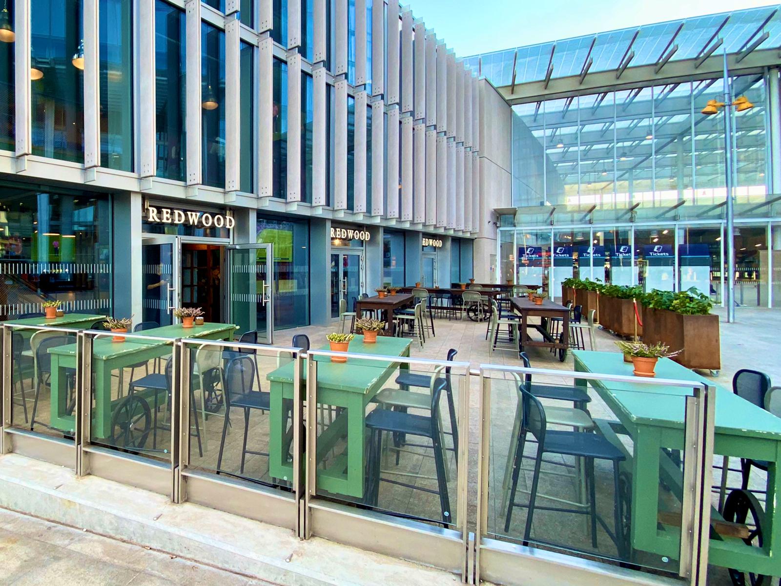 Modern outdoor sports lounge with green seating for casual networking events.