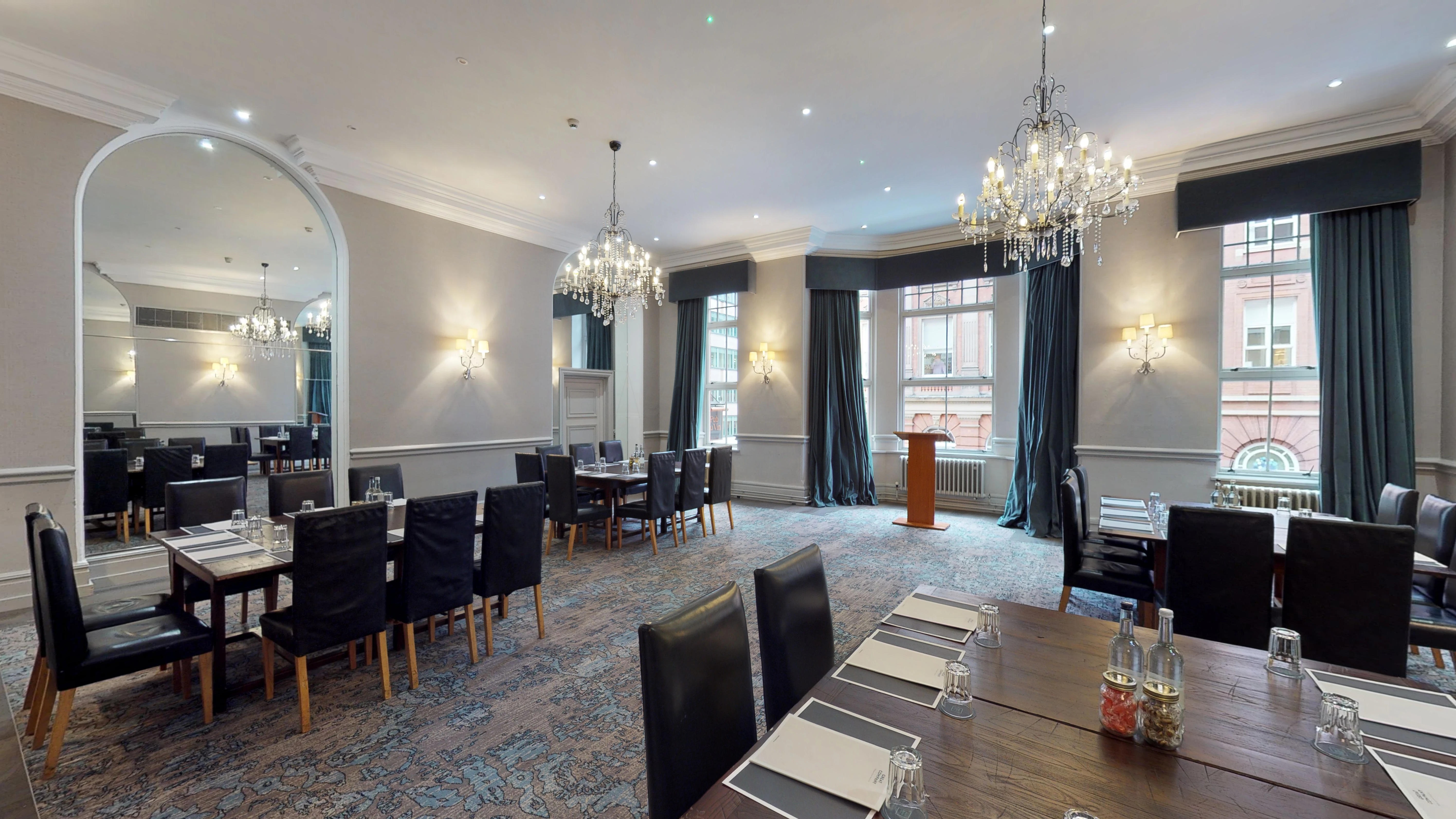 Belle Epoque meeting room at Hotel du Vin, ideal for corporate events with elegant chandeliers.
