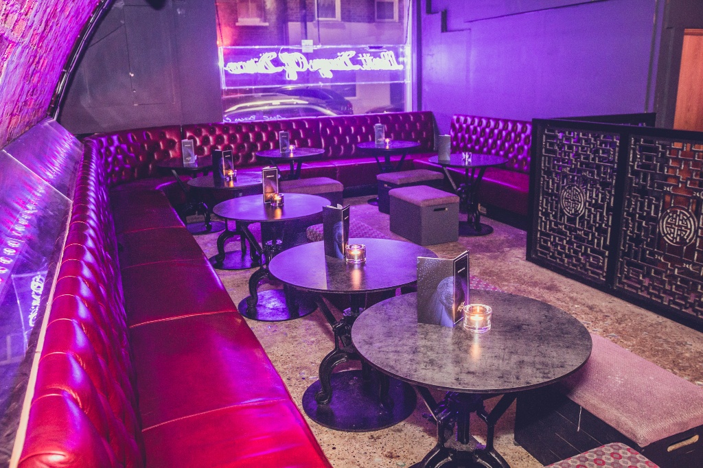 Stylish lounge with plush red seating for intimate networking events and cocktail receptions.