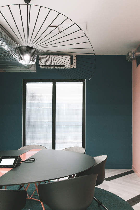 Modern meeting space in Huckletree Ancoats with large windows for natural light.