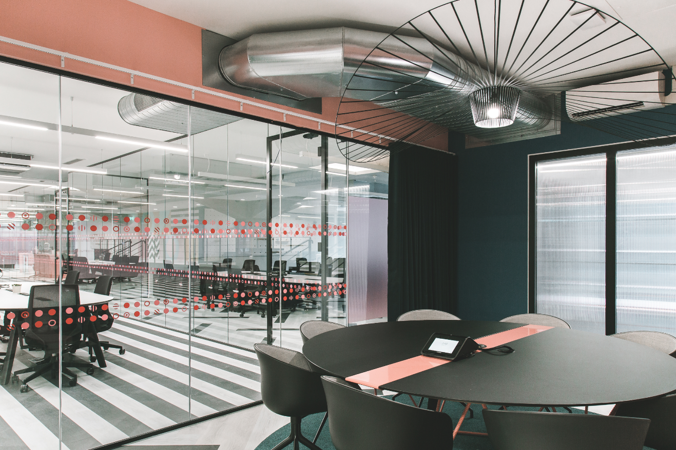 Modern meeting space with glass walls for creative collaboration in Huckletree Ancoats.