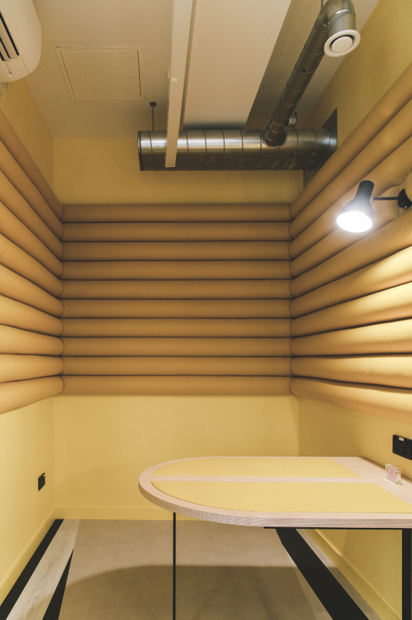 Soundproof podcast studio with padded walls for meetings and collaboration in Huckletree Ancoats.