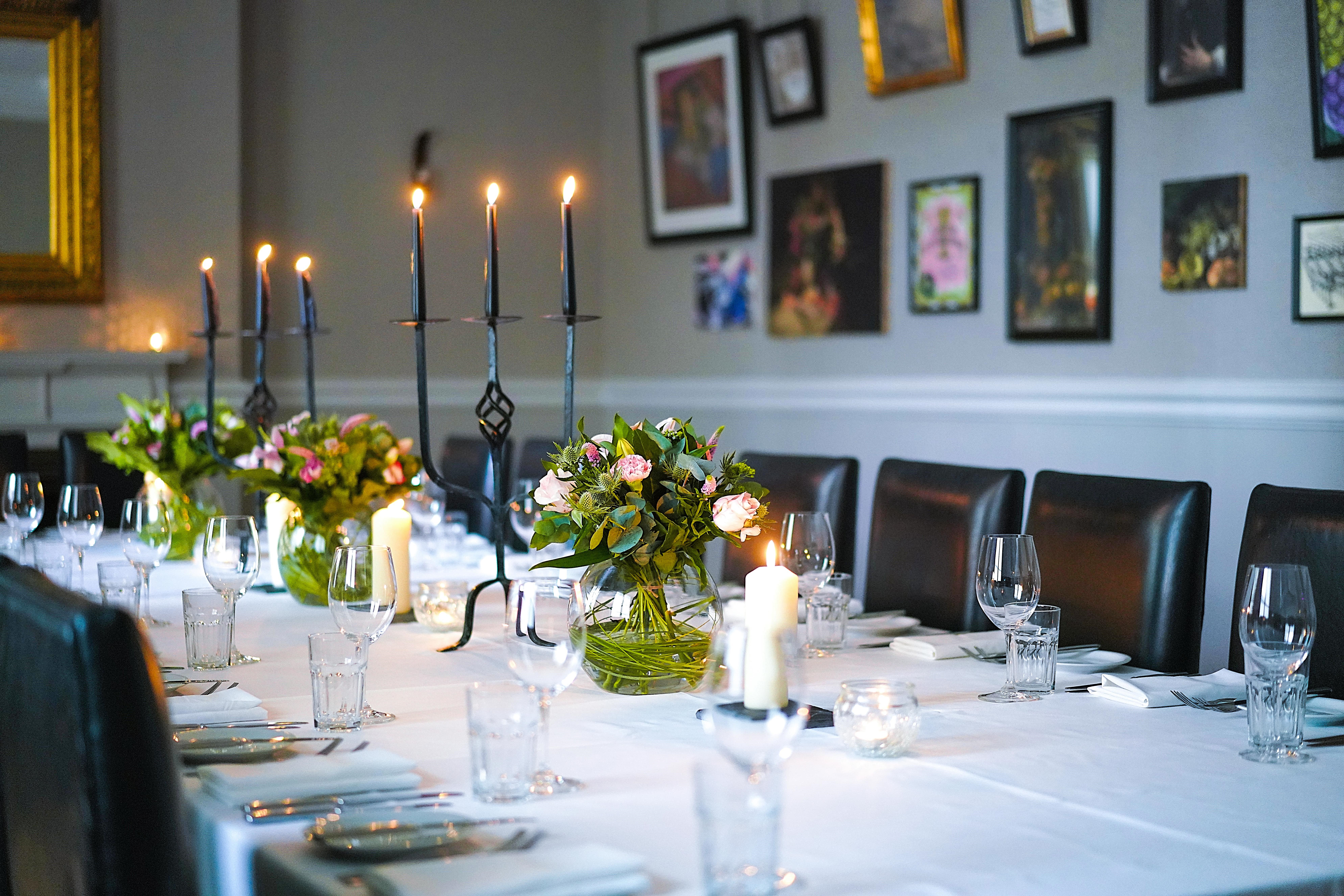 Elegant dining table with candlelight at Sassicaia, Hotel du Vin Birmingham for events.