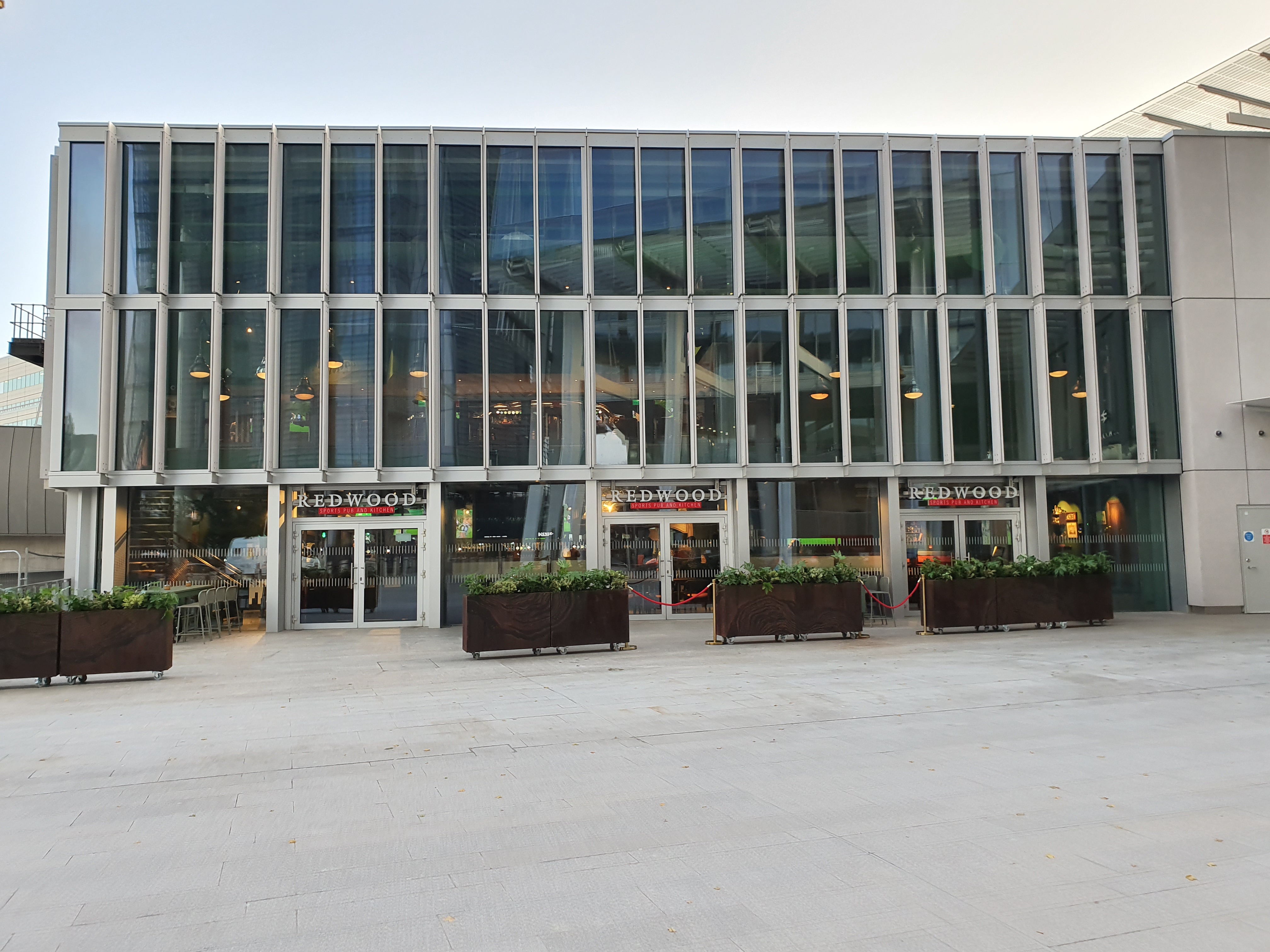 Modern venue with glass facade for meetings and events at Redwood Sports Pub & Kitchen.