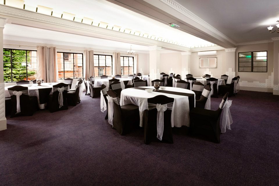 Elegant event space at Burton Ritz with black and white decor for weddings and meetings.