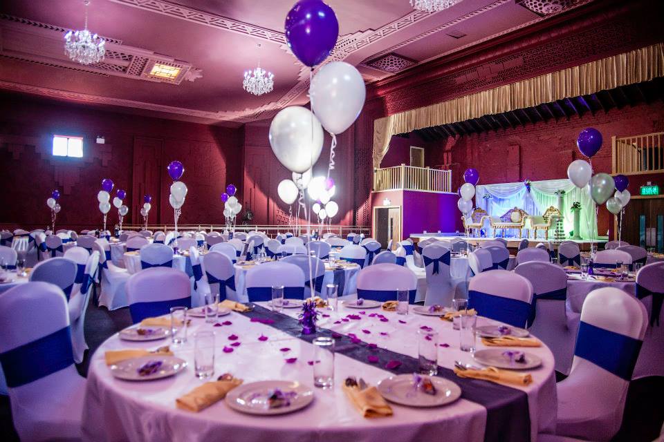 Elegant event space at Burton Ritz with white tablecloths, perfect for weddings and celebrations.