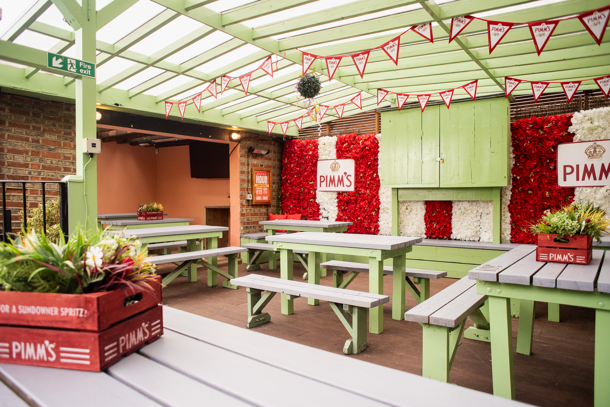 Roof Terrace at Abbey Tavern with rustic benches, ideal for outdoor events and gatherings.