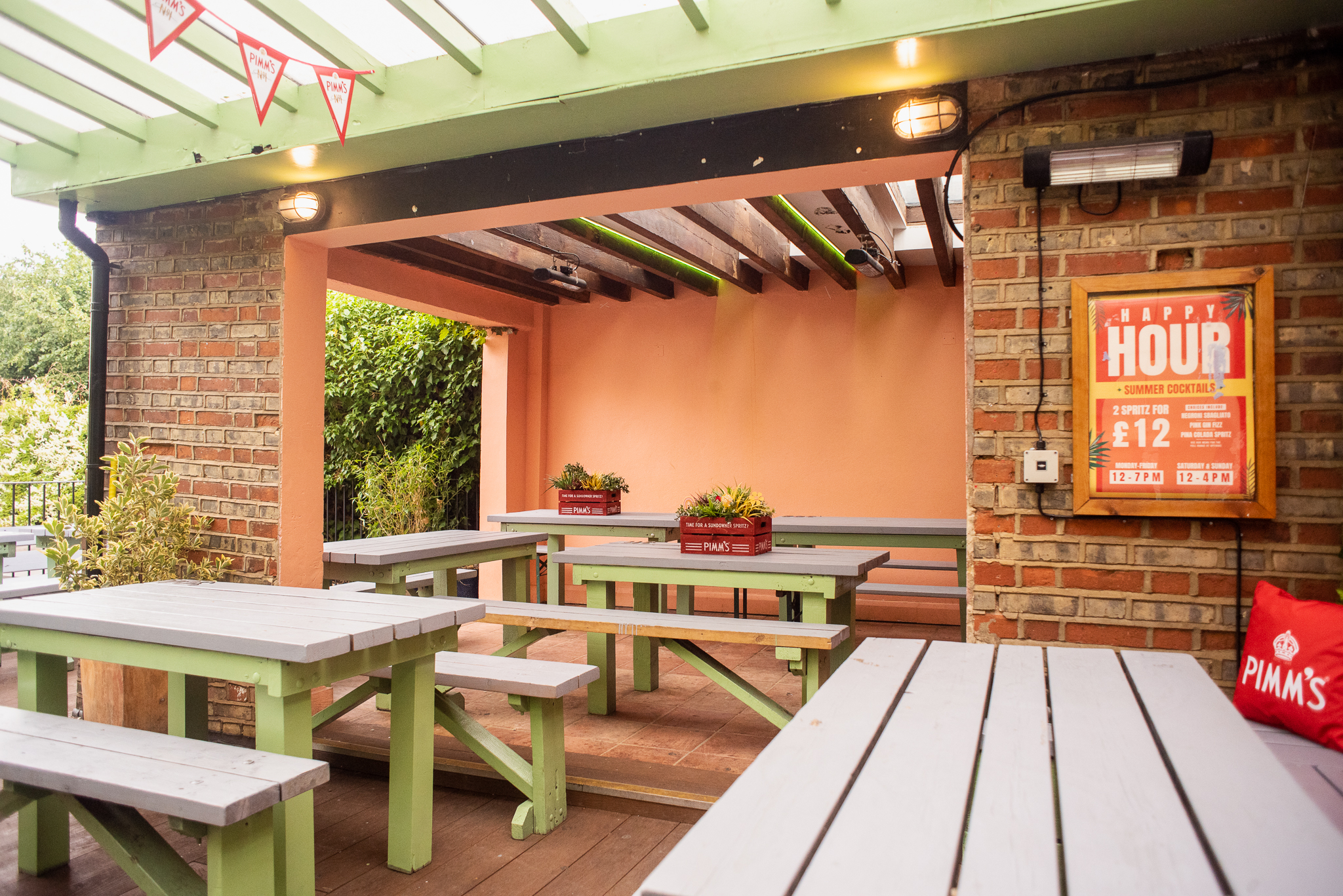 Roof Terrace at Abbey Tavern with rustic tables, ideal for casual gatherings and networking.