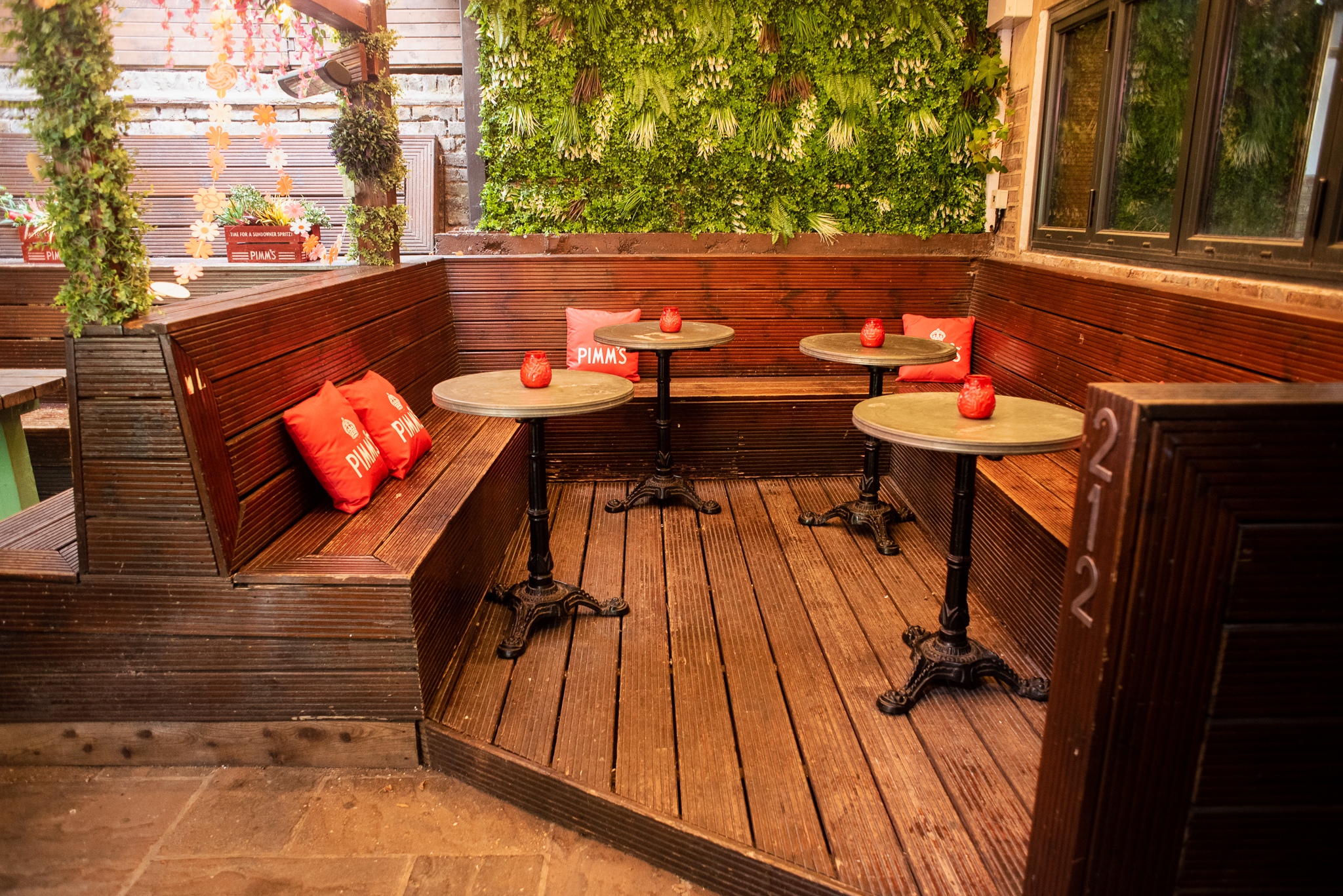 Cozy roof terrace at Abbey Tavern with wooden seating, ideal for networking events.