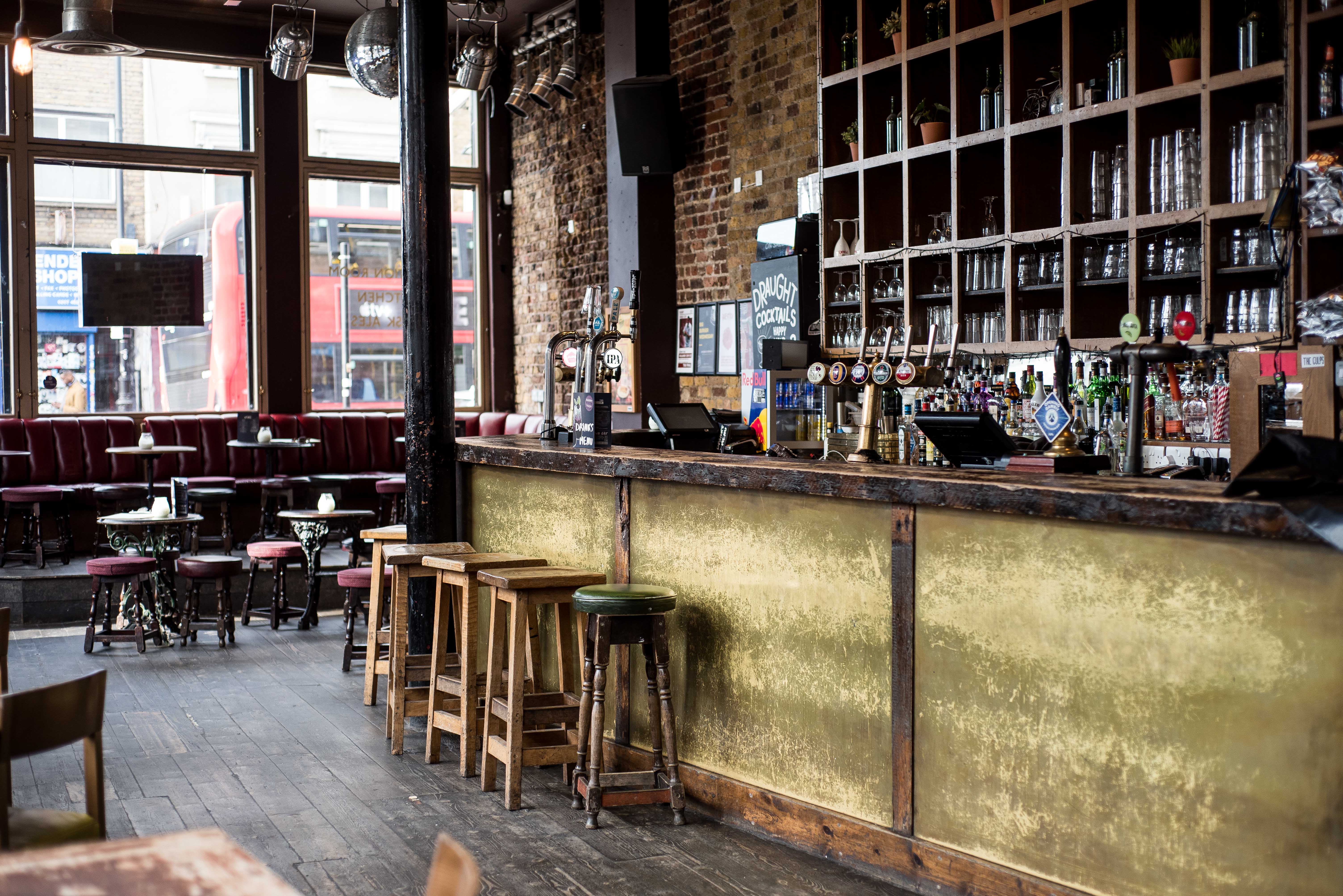 Stylish bar venue with exposed brick, ideal for networking events and informal meetings.