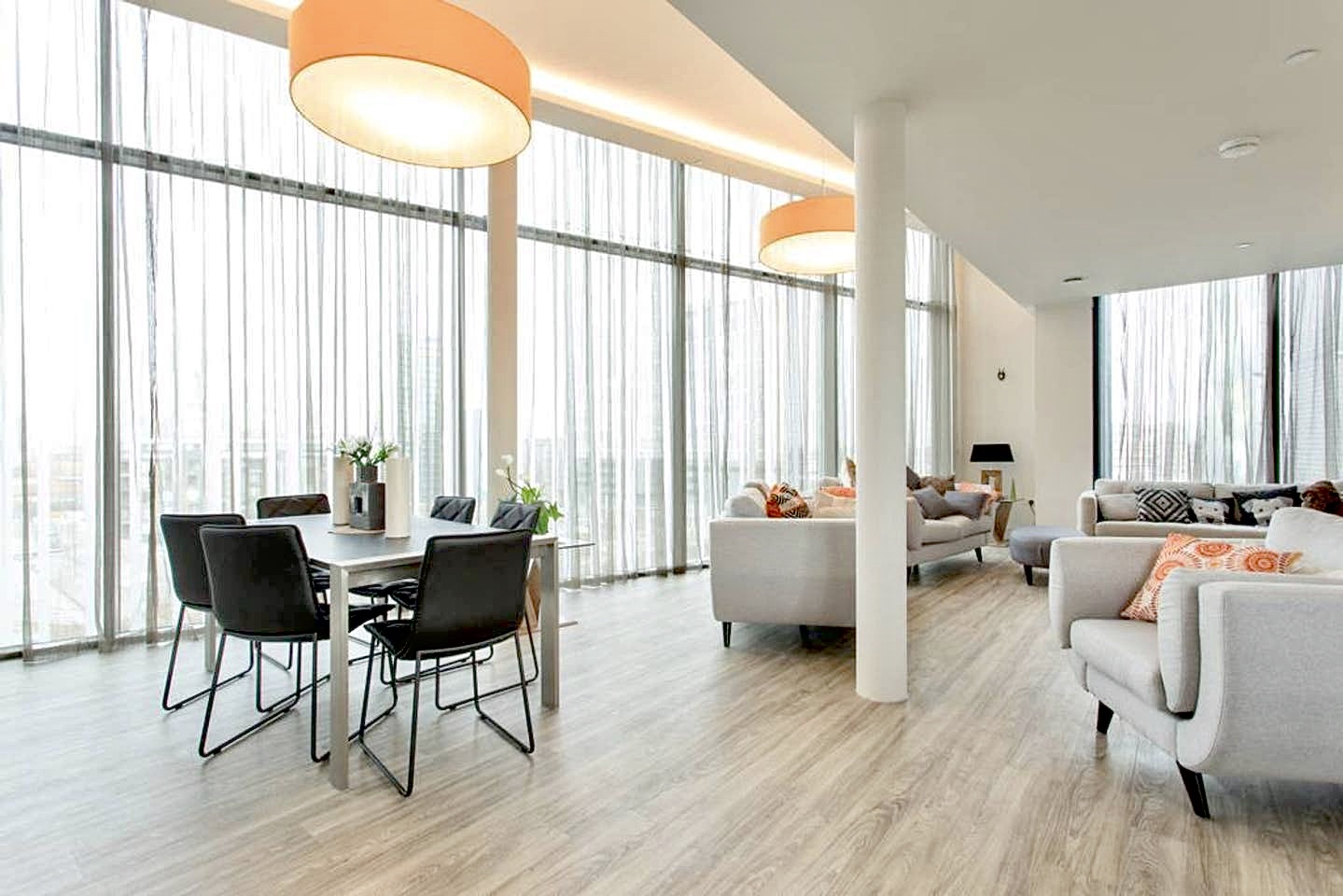 Modern penthouse event space with large windows for filming and corporate gatherings.