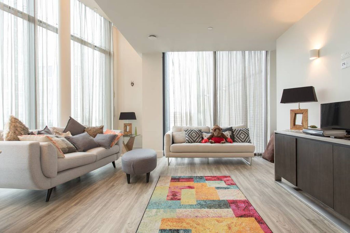 Modern penthouse lounge for filming and networking events with natural light.