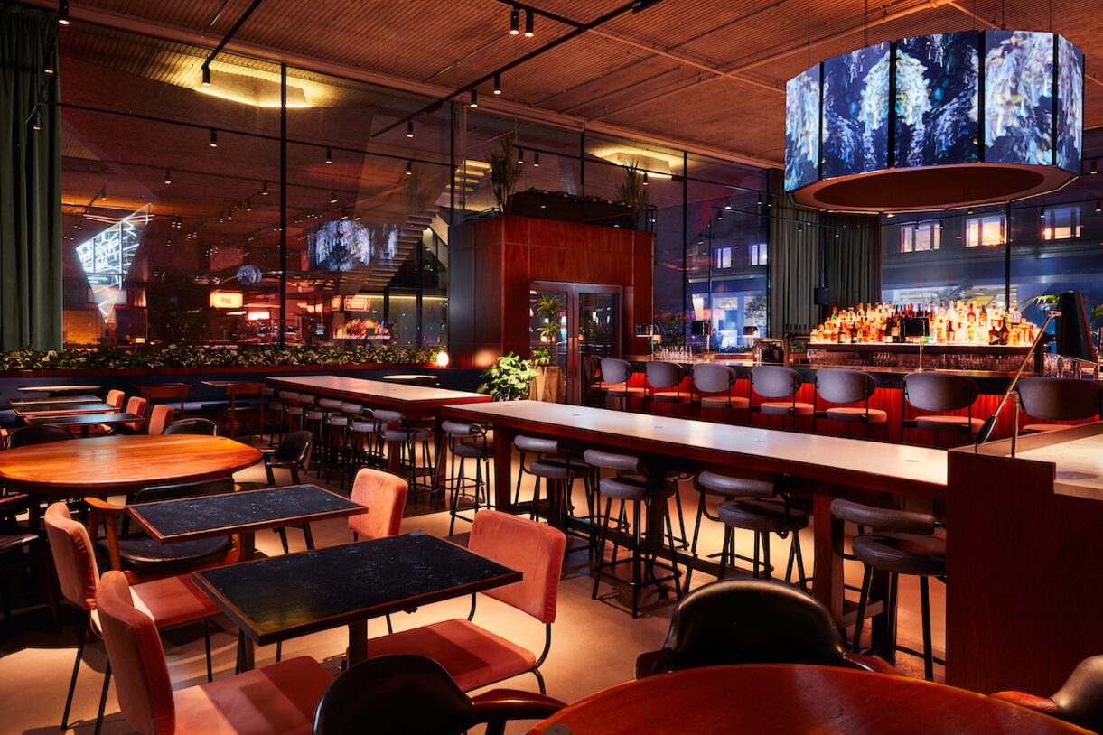 Modern event venue with stylish decor and seating for meetings and gatherings.