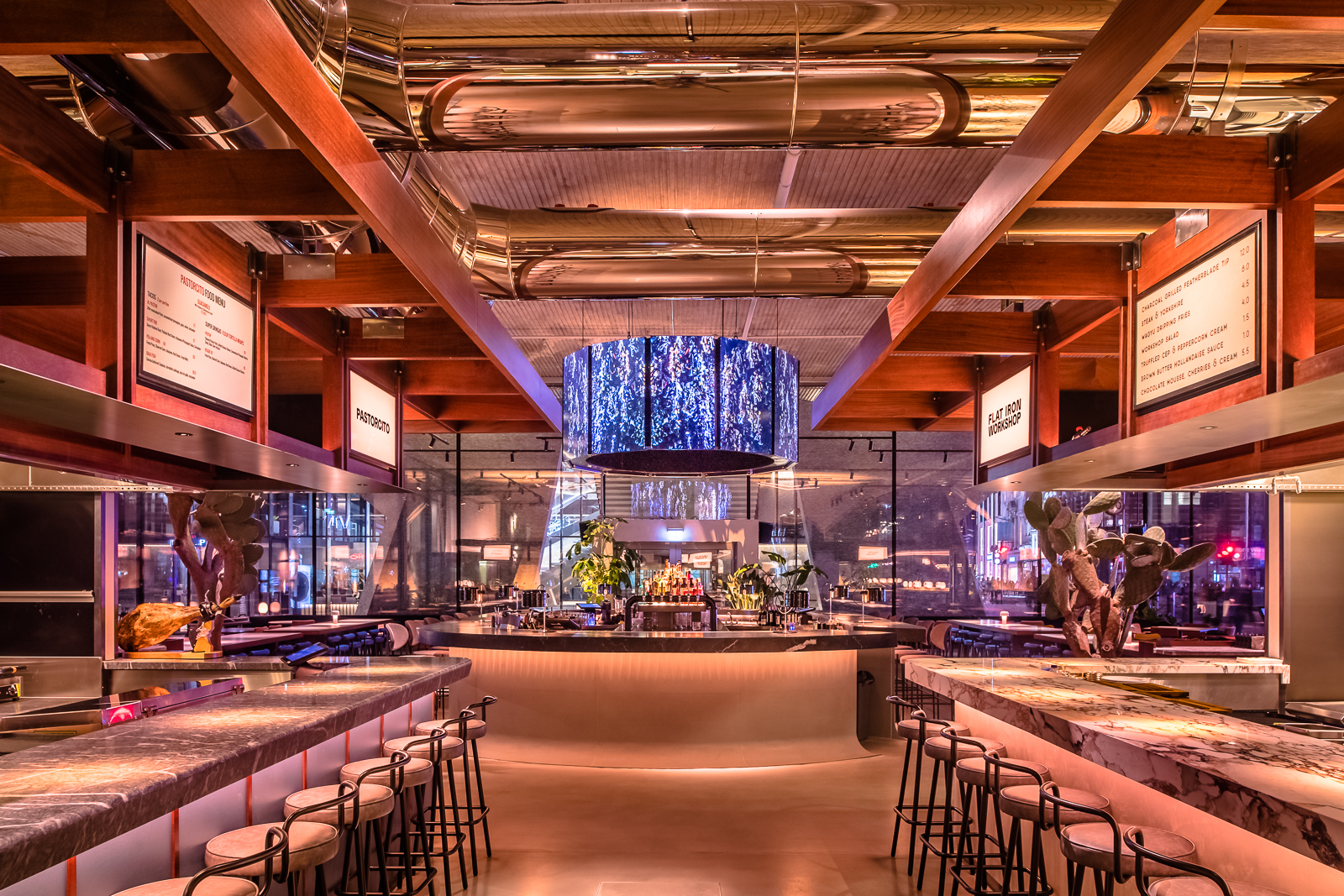 Modern event space with sleek bar, ideal for networking and social gatherings.