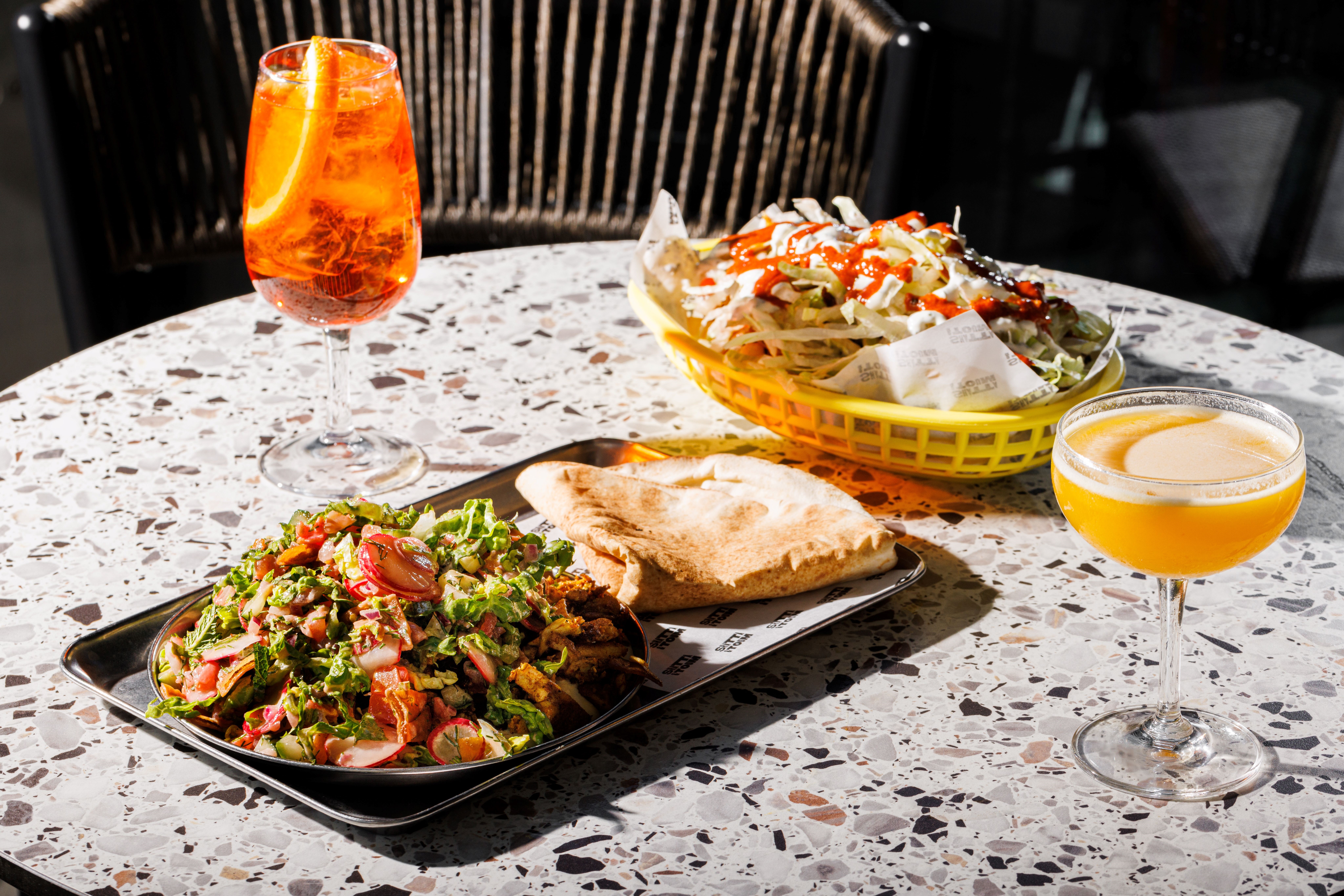 Vibrant table setting with colorful dishes for casual networking event at The Terrace.