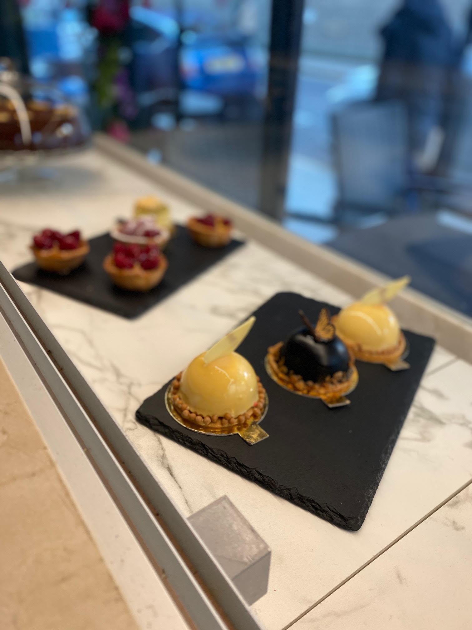 Elegant dessert display on slate boards at Broski Lounge for special events.