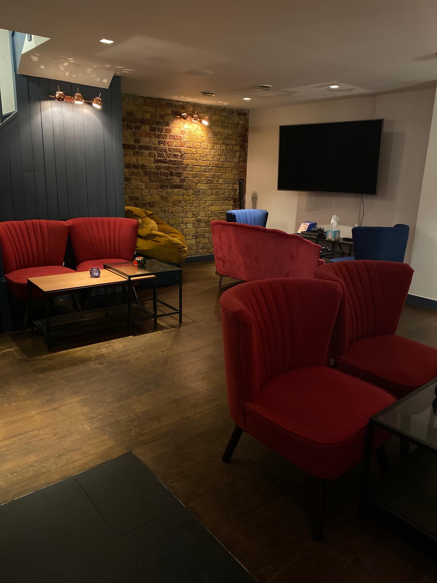 Cozy lounge with vibrant seating, ideal for networking events and informal meetings.