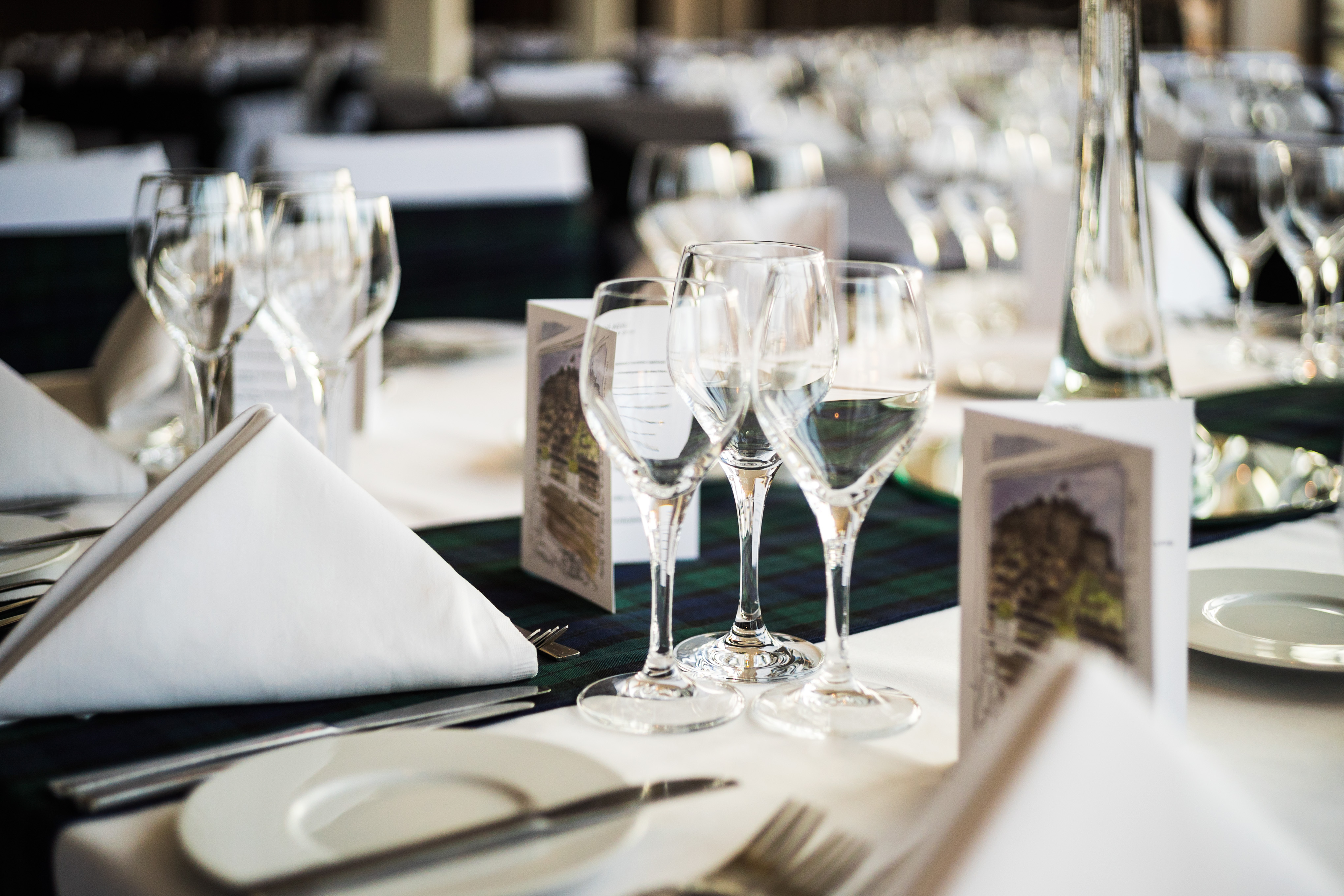Elegant dining setup at Apex Grassmarket Hotel for formal events, showcasing polished glassware.