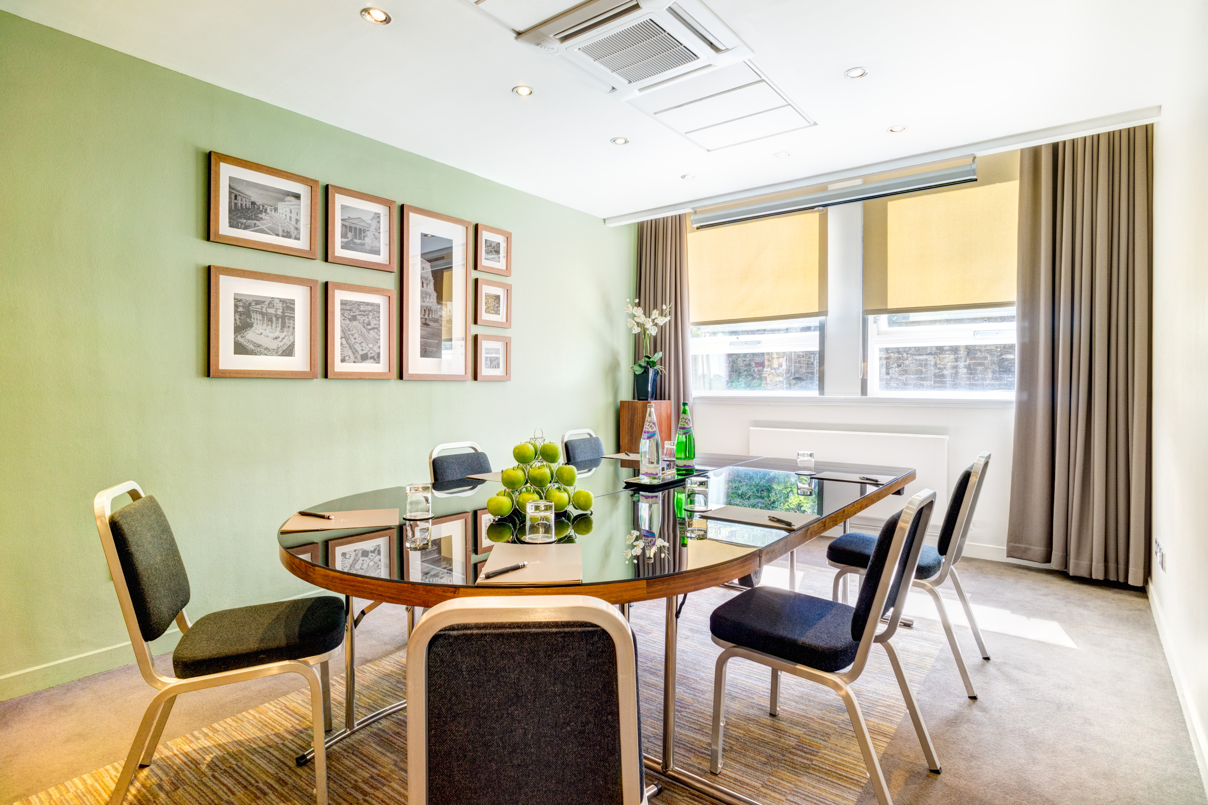 Modern meeting room with glass table, ideal for collaborative sessions in Apex Grassmarket Hotel.