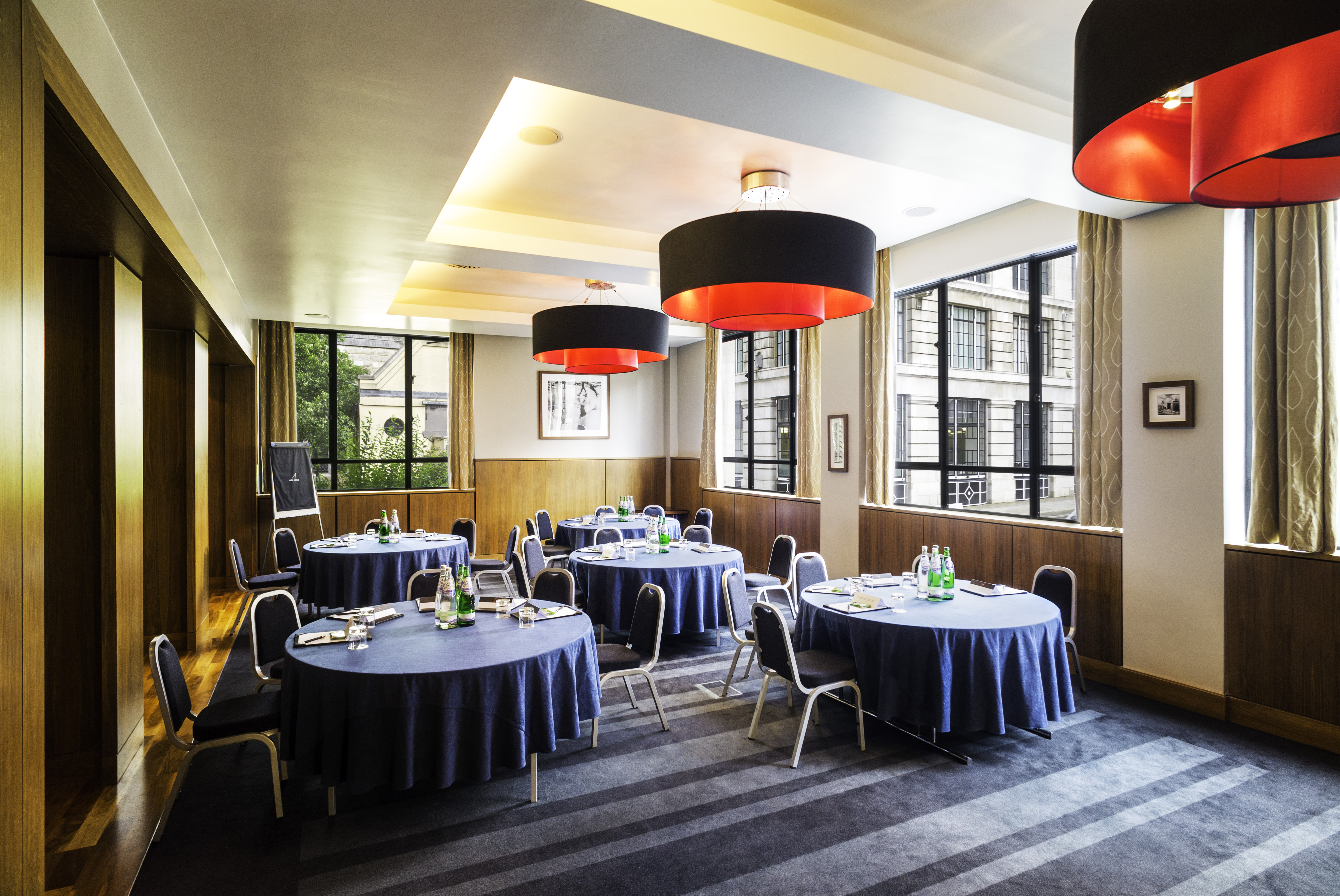 City Suite meeting room with navy tables, perfect for corporate events and workshops.