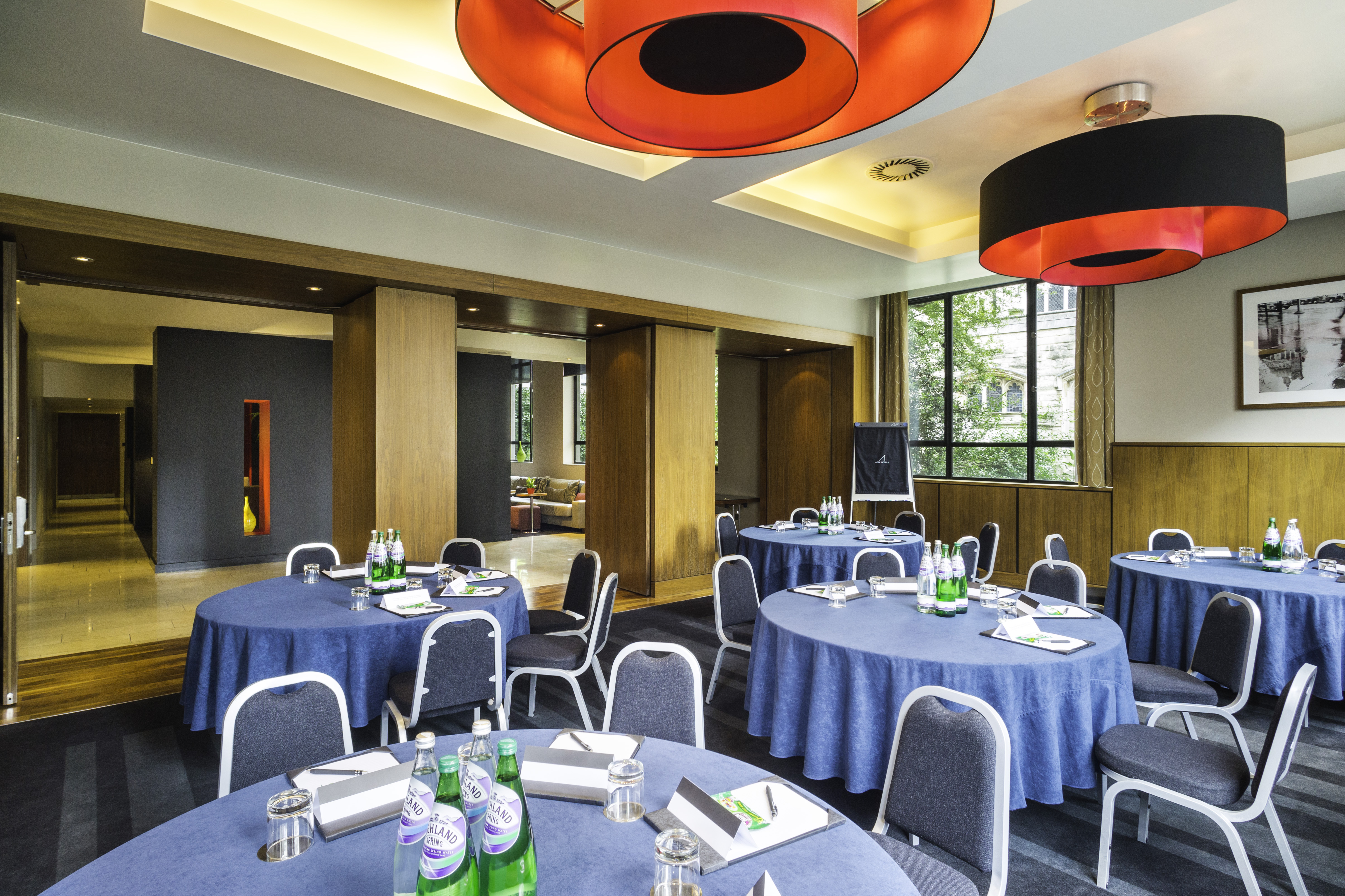 City Suite meeting room with blue tablecloths, ideal for workshops and conferences.