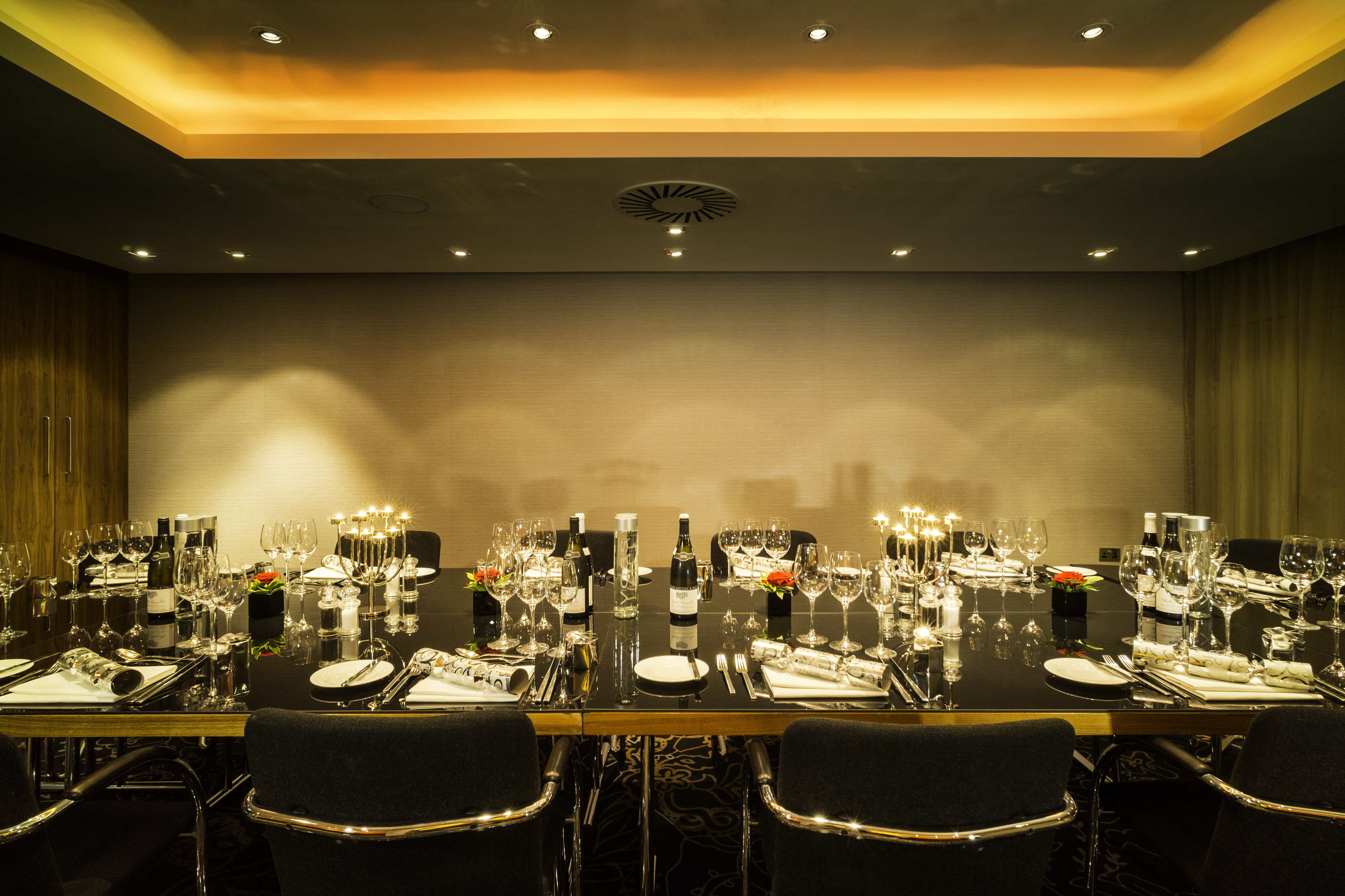 Elegant dinner setup in Geneva meeting room at Apex City of London Hotel.