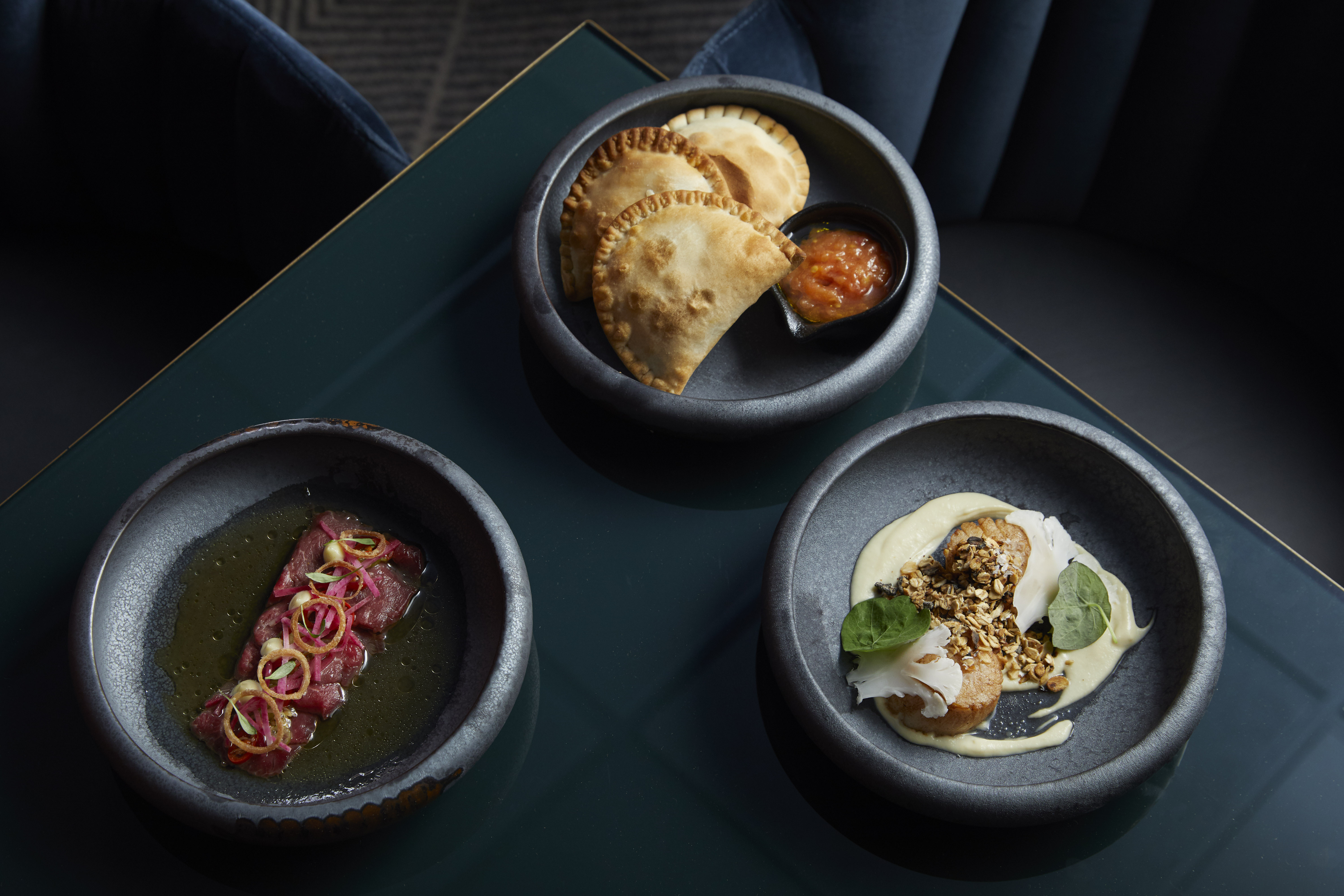 Semi-private dining room with gourmet dishes for upscale events at Gaucho Charlotte Street.