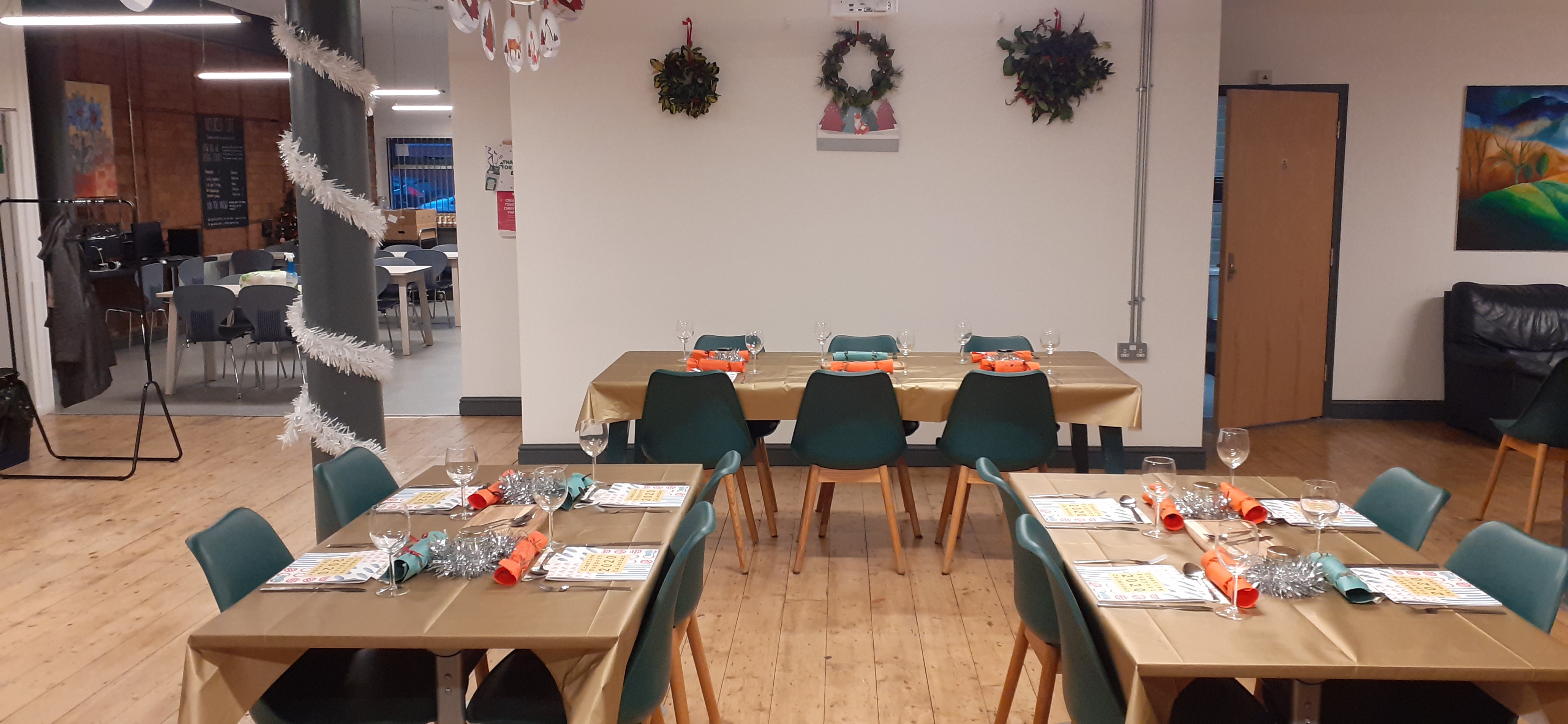 Elegant dining setup with gold tablecloths for holiday gatherings at Creative Together.