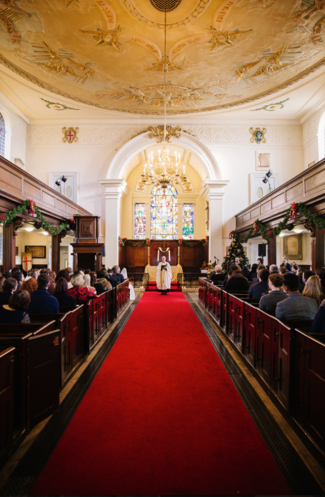 St George the Martyr Church with stained glass, perfect for elegant weddings and ceremonies.