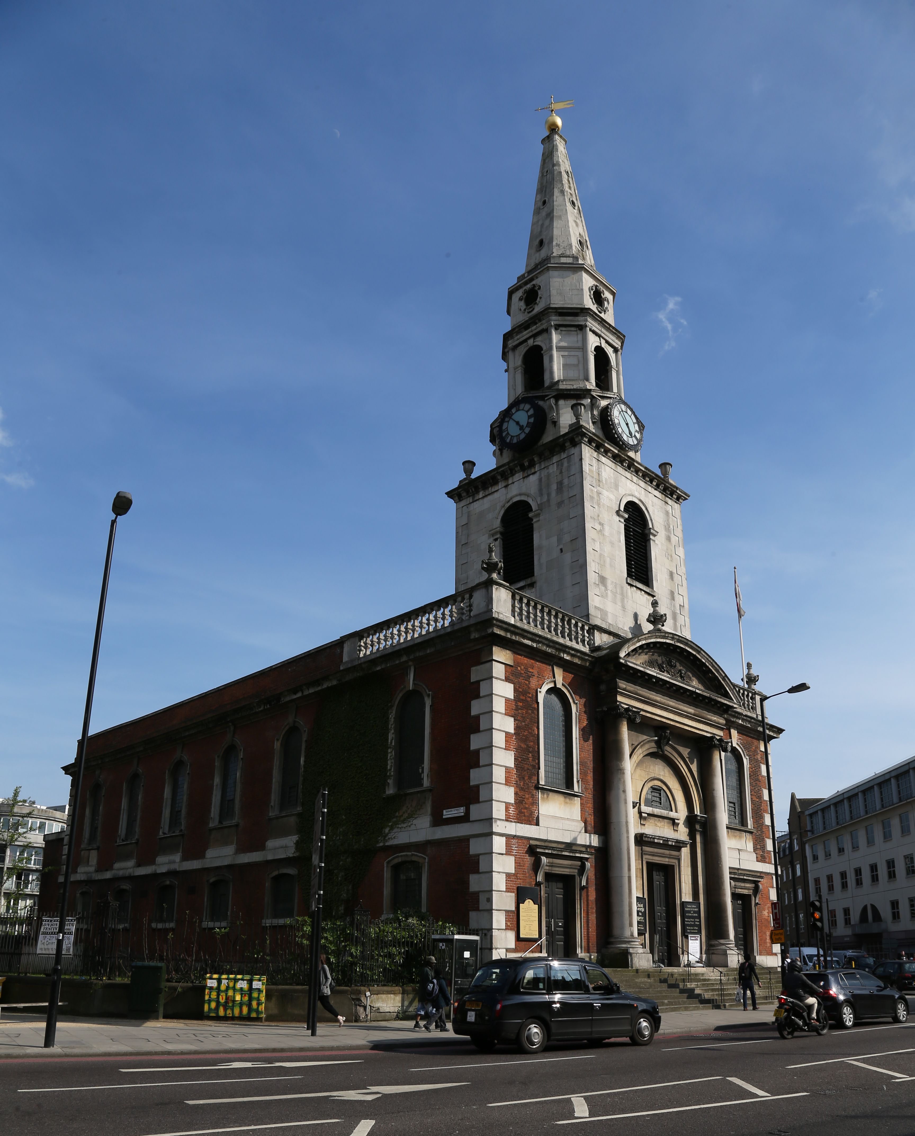 Historic St George the Martyr Church with clock tower, perfect for events and gatherings.