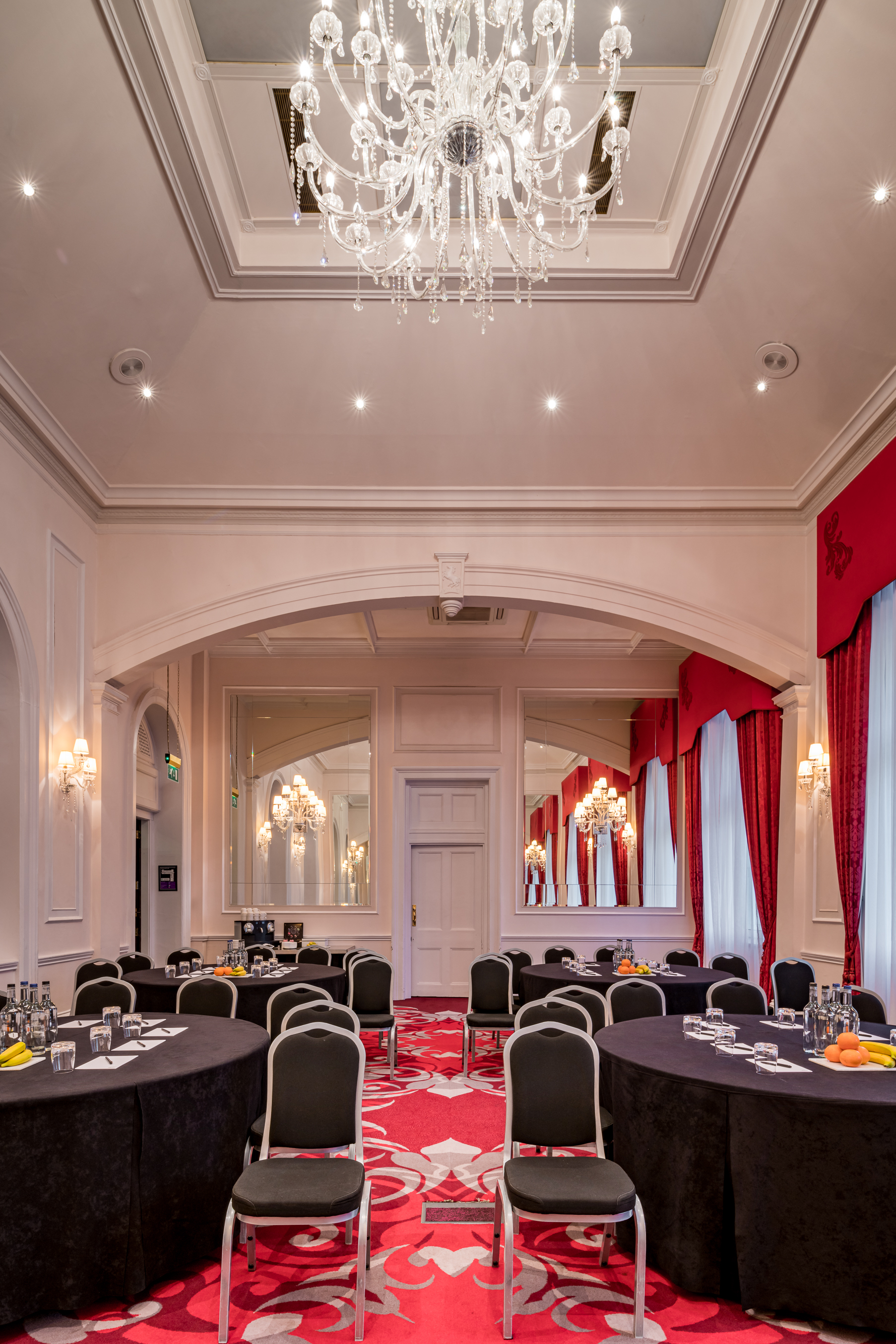 Elegant event space at Clermont Charing Cross with chandeliers, ideal for corporate meetings.