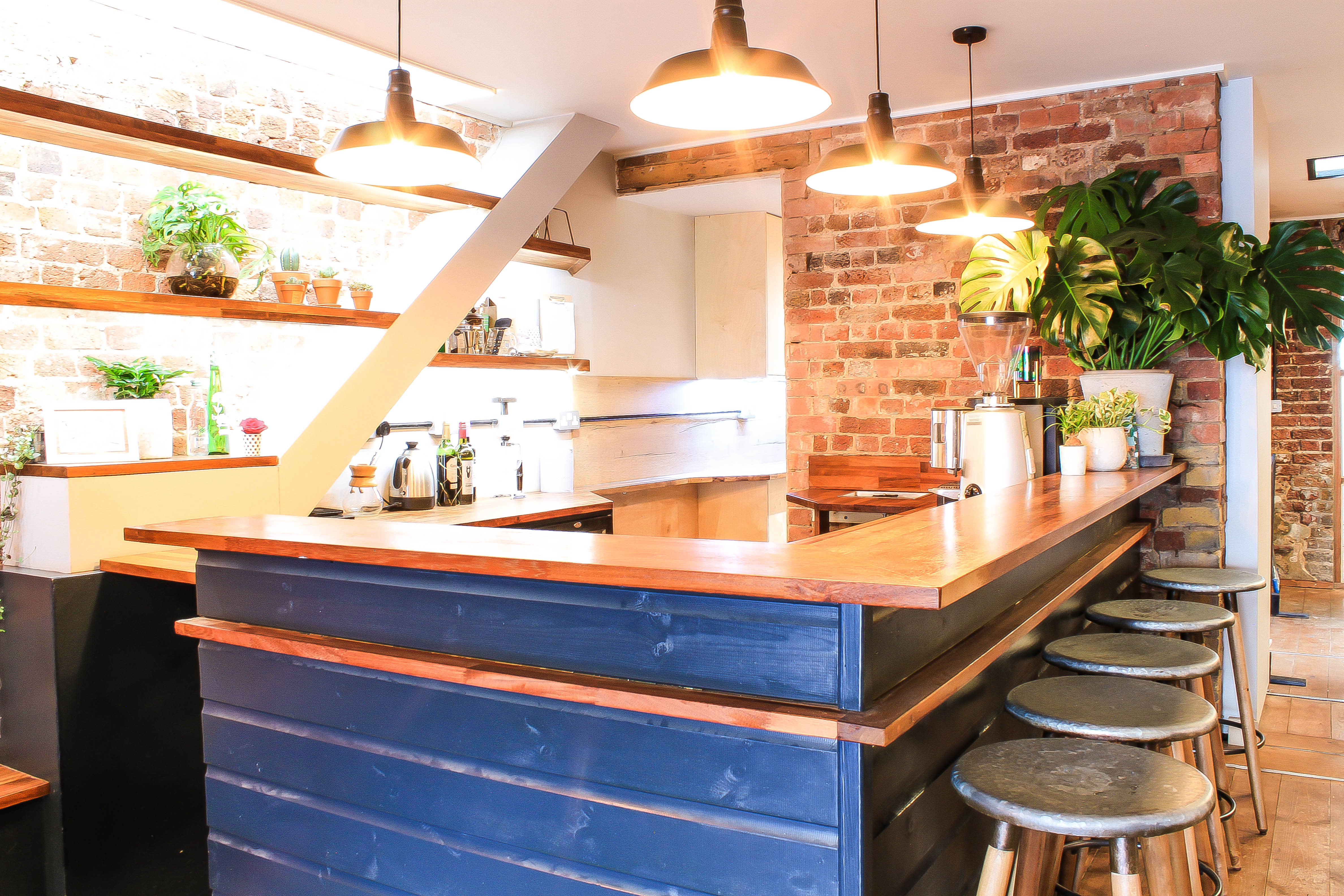 Modern kitchen venue with warm lighting for intimate gatherings and networking events.