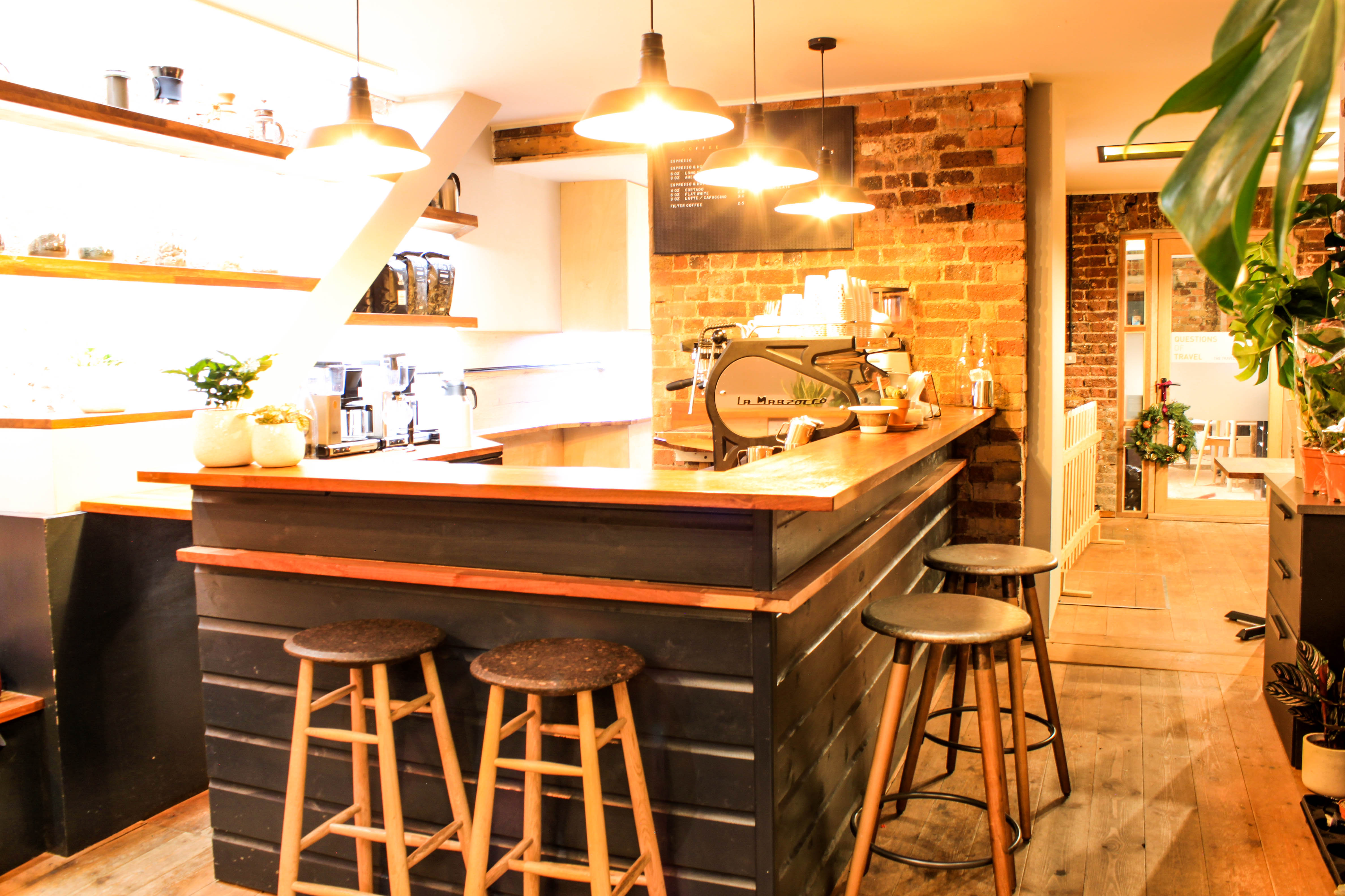 Modern kitchen venue with rustic accents for networking events and informal meetings.