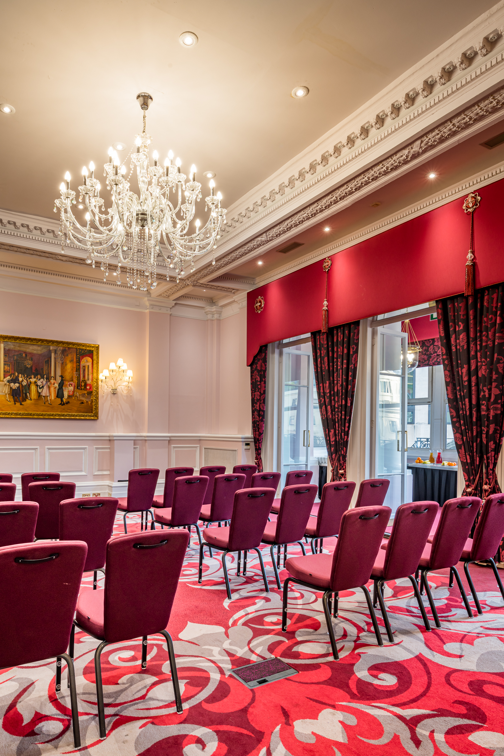 Elegant meeting space in Canterbury with chandelier, perfect for corporate events.