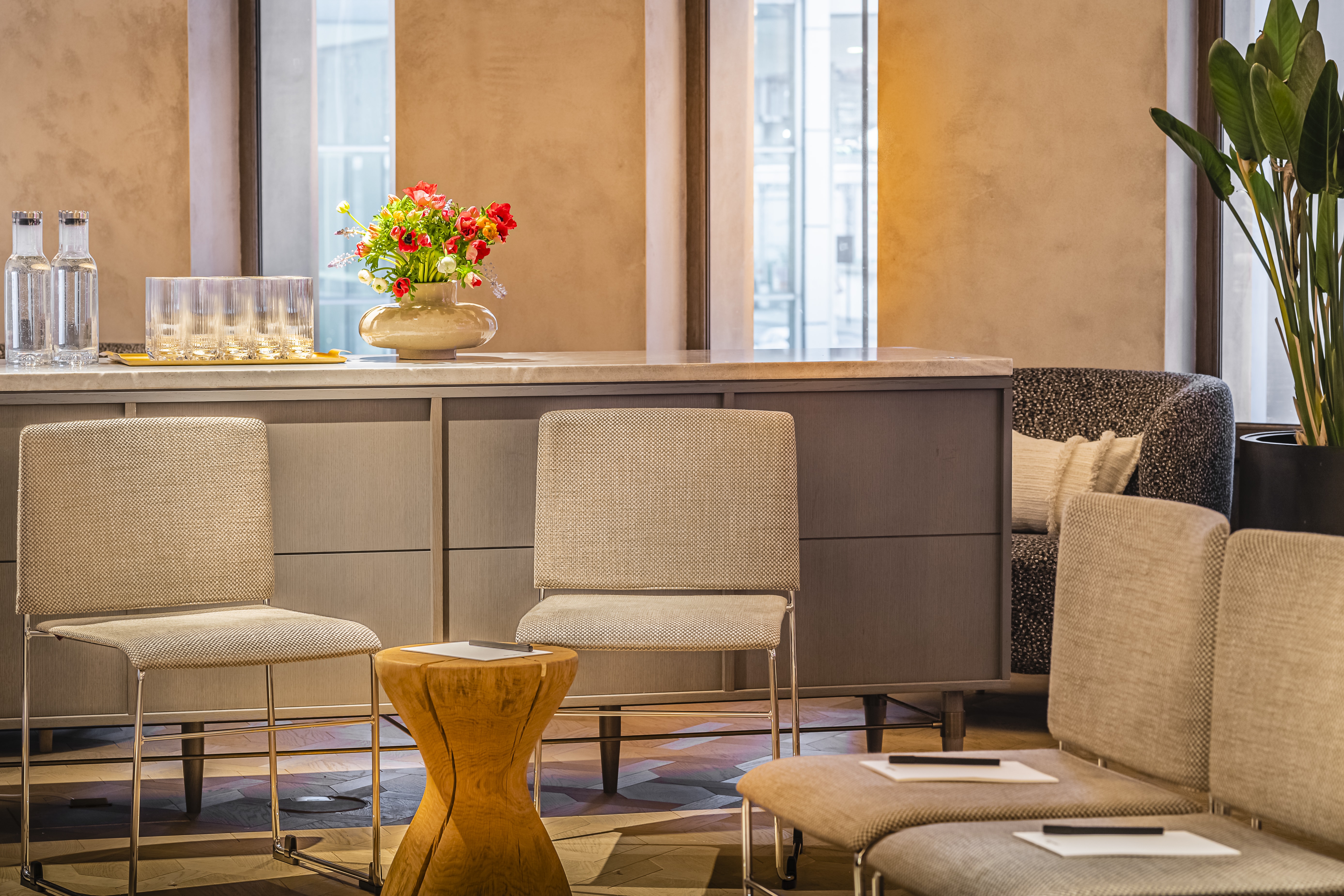 Stylish meeting space at The Mezzanine, featuring modern seating and natural light.