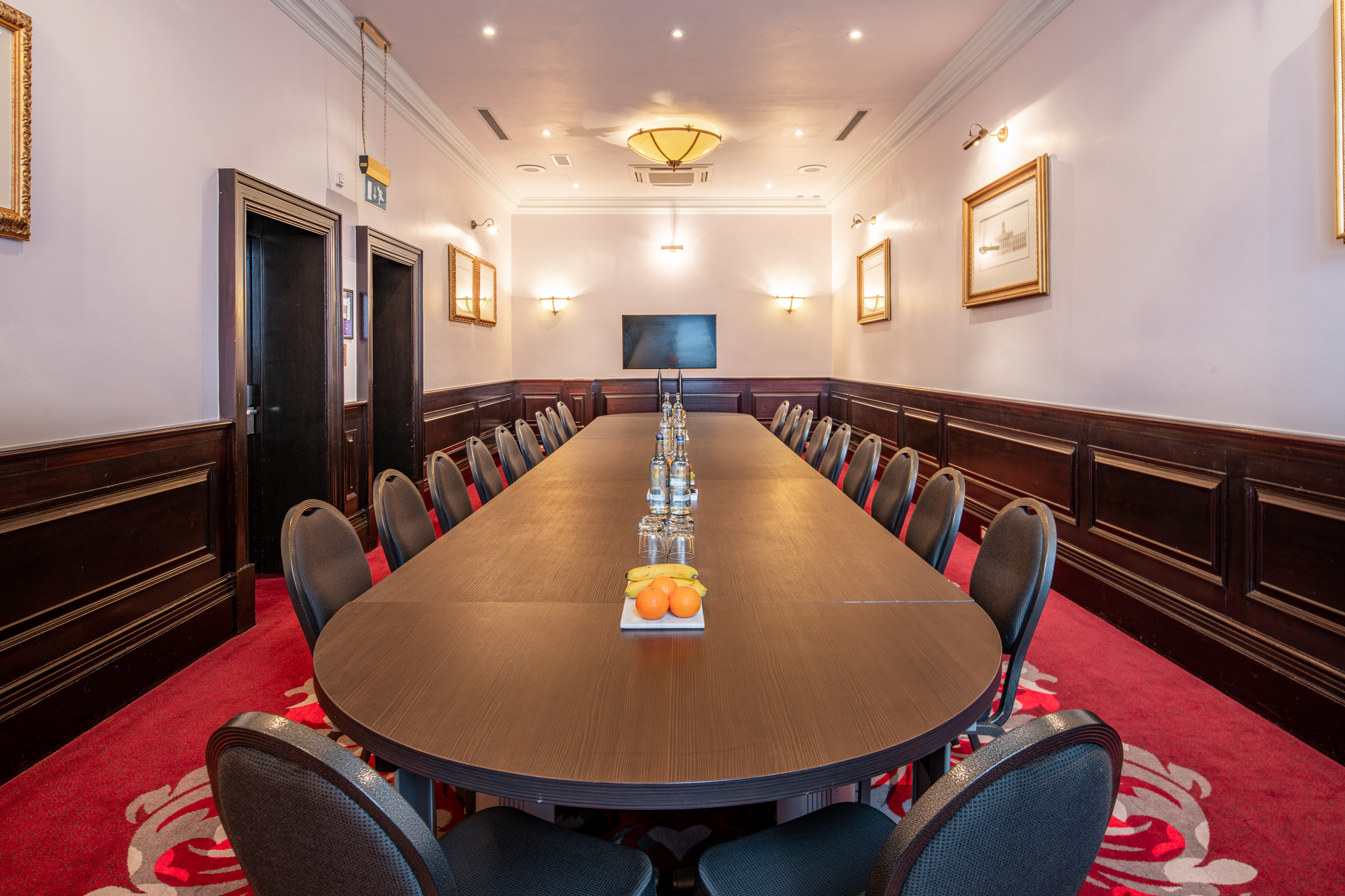 Boardroom at The Clermont Charing Cross, elegant table for corporate meetings and events.