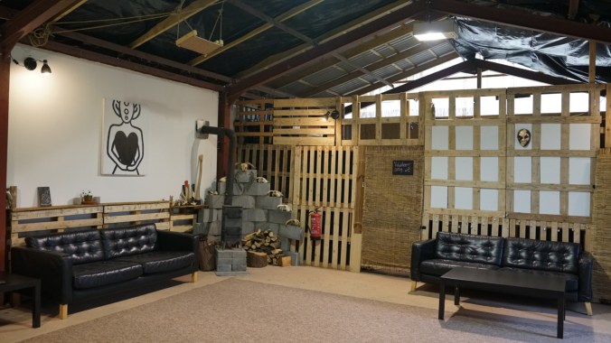 Versatile rustic event space with cozy seating for workshops and gatherings.