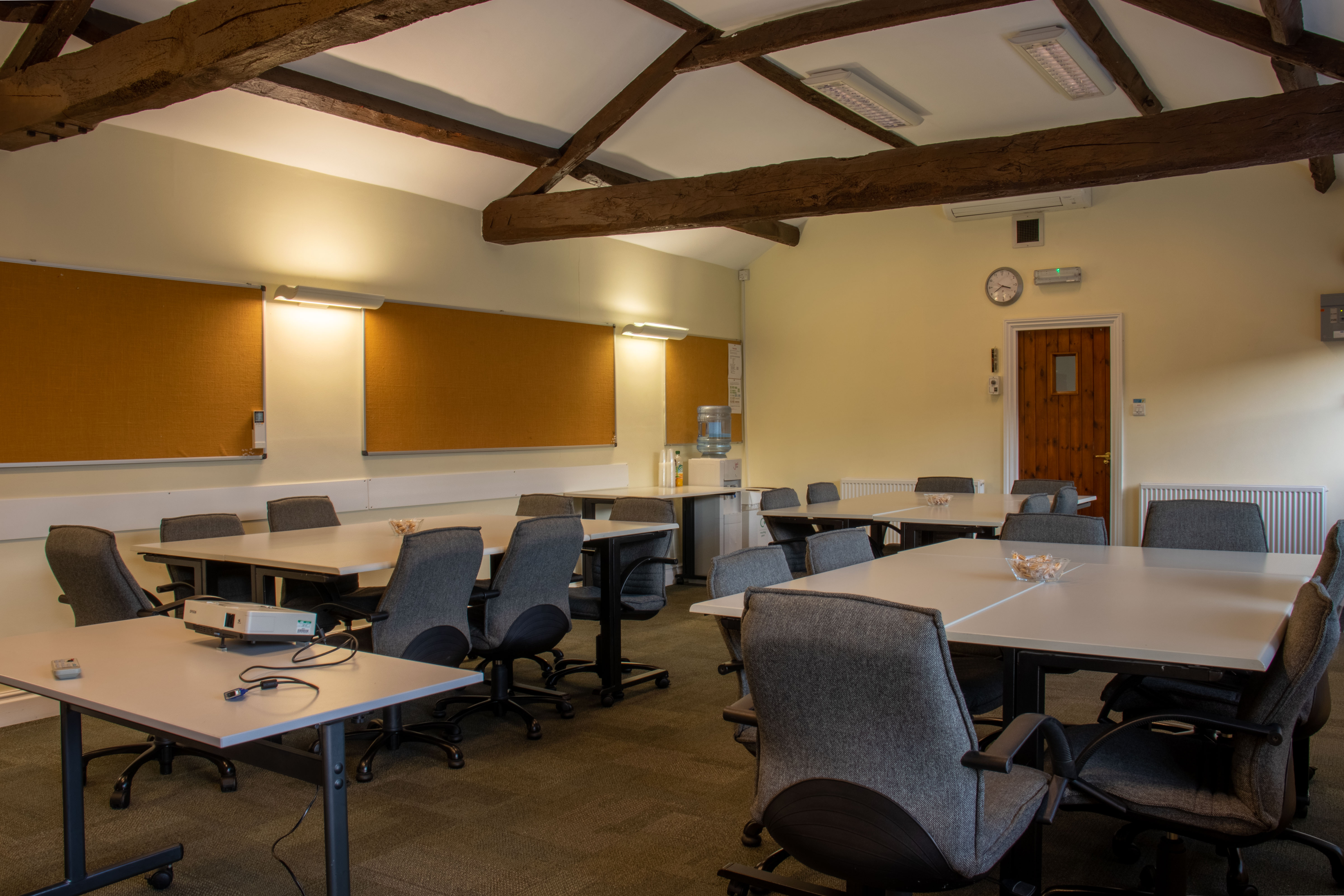 Versatile meeting space at Brympton, featuring flexible seating and natural light for workshops.