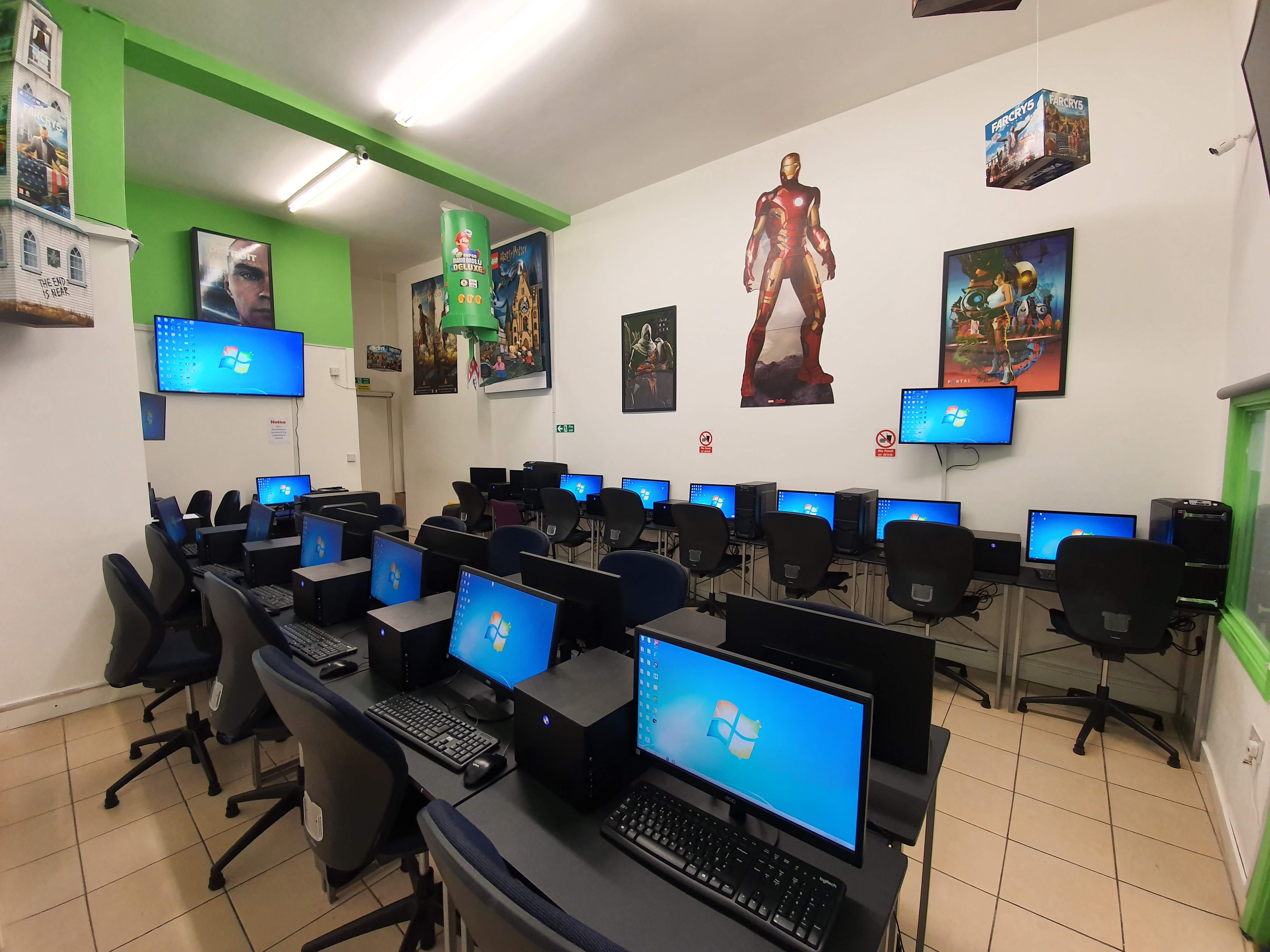 Tech-equipped training room with computer stations for workshops and seminars.