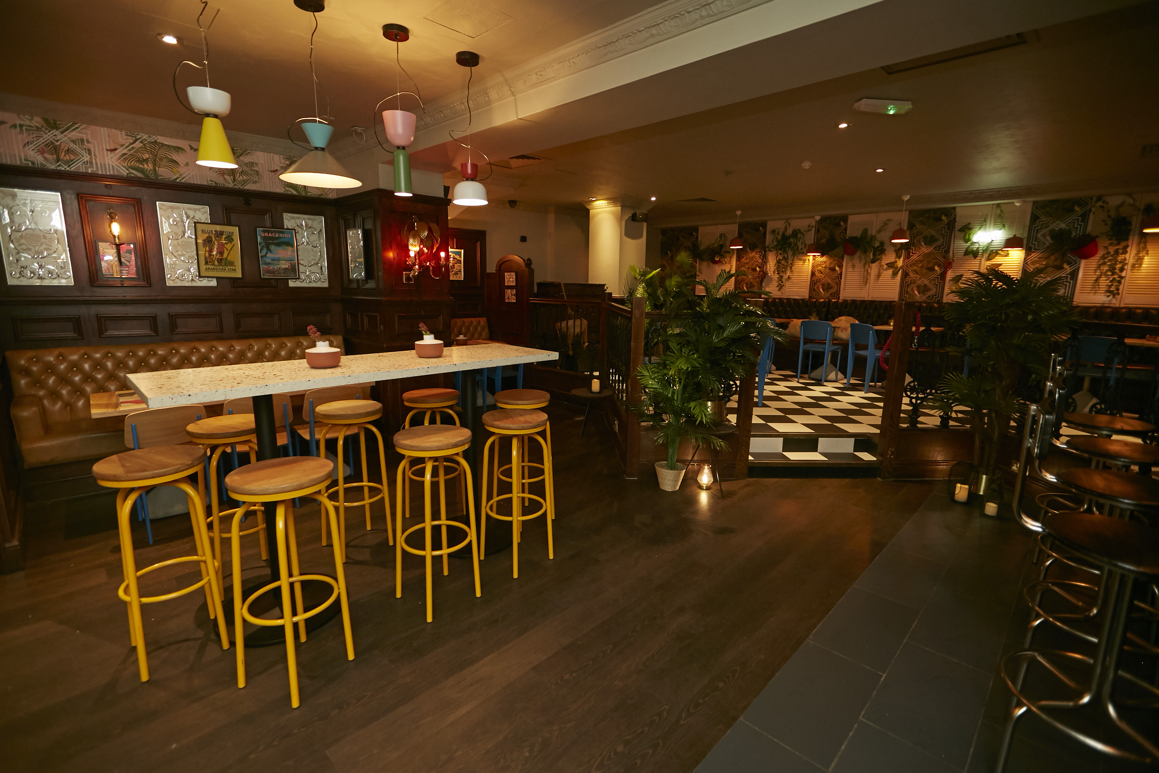 Versatile bar and restaurant event space with warm lighting and casual seating.
