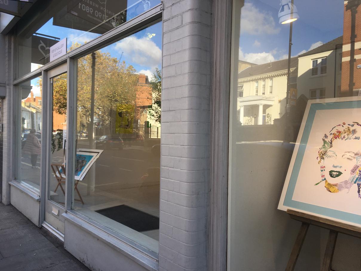 Bright storefront with large windows, ideal for art exhibitions and community gatherings.
