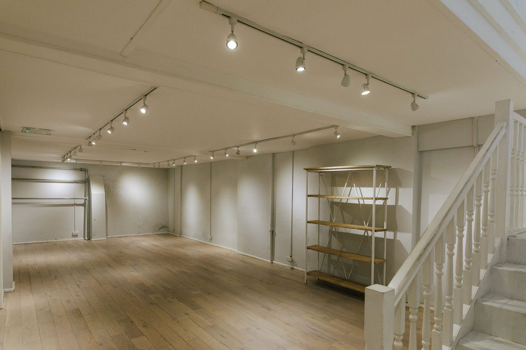 Versatile event space at 725 Fulham Road with wooden flooring for meetings and workshops.