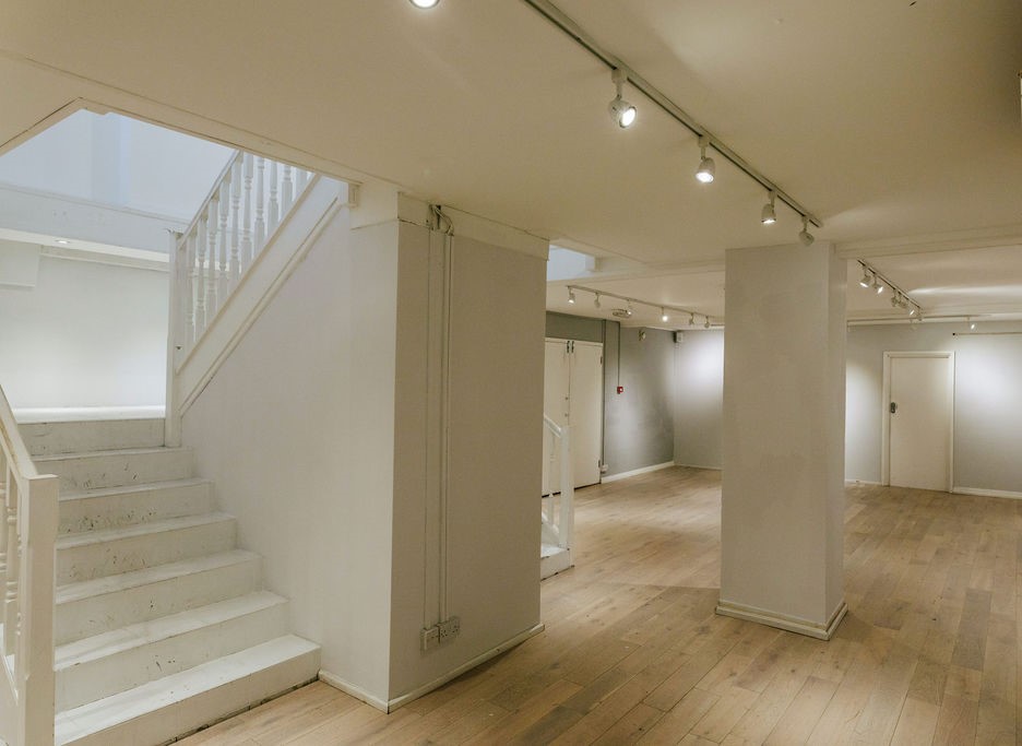Versatile event space at 725 Fulham Road with natural light, ideal for meetings and gatherings.